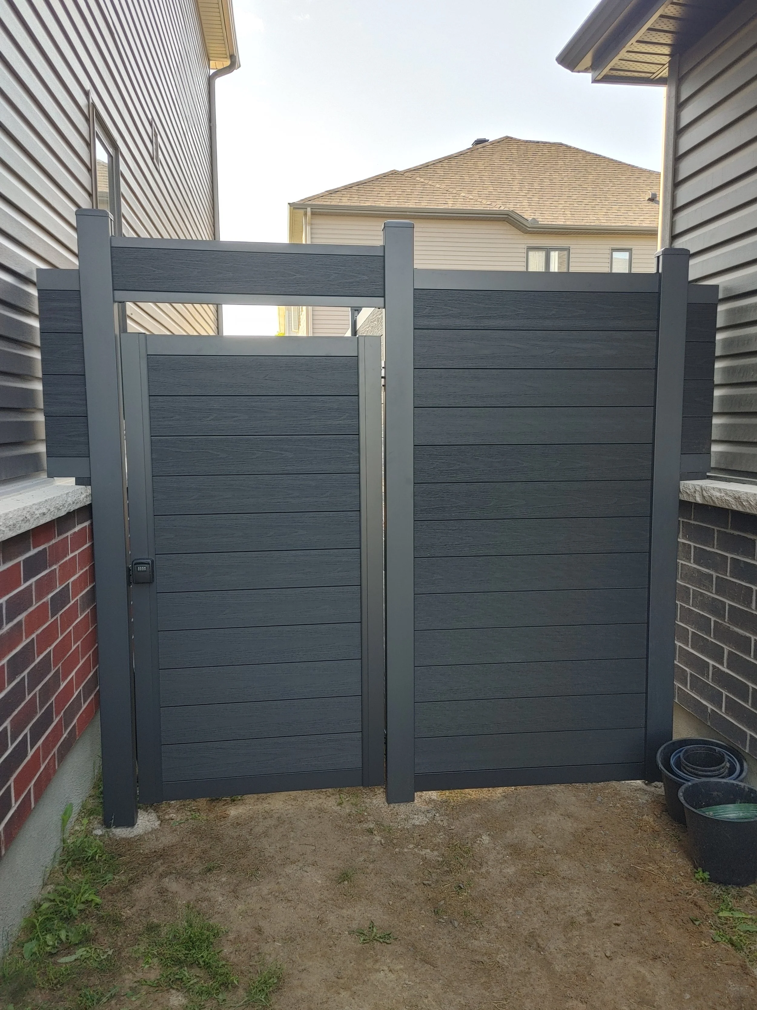 Black WPC Fence in Manotick, 2025. StandArt Fence 