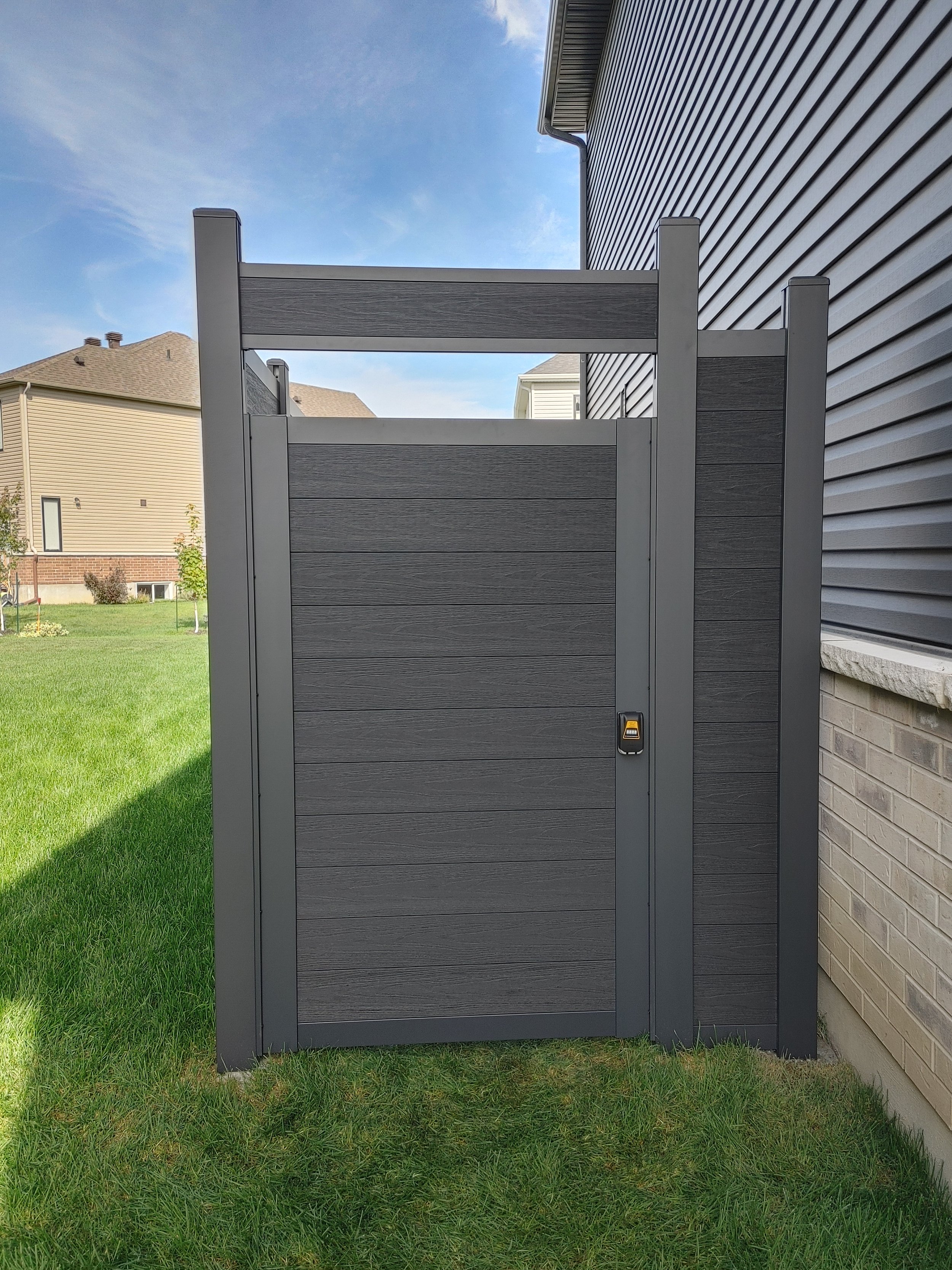 Black WPC Fence in Manotick, 2025. StandArt Fence