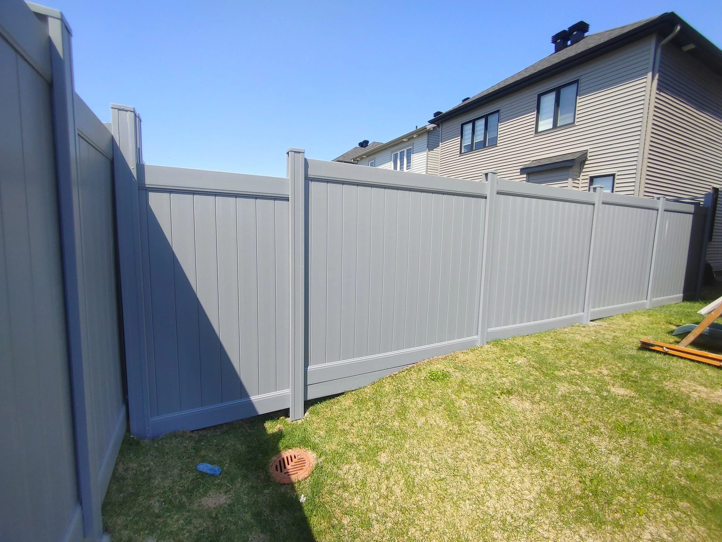 Grey PVC Fence in Barrhaven, 2025. StandArt Fence 