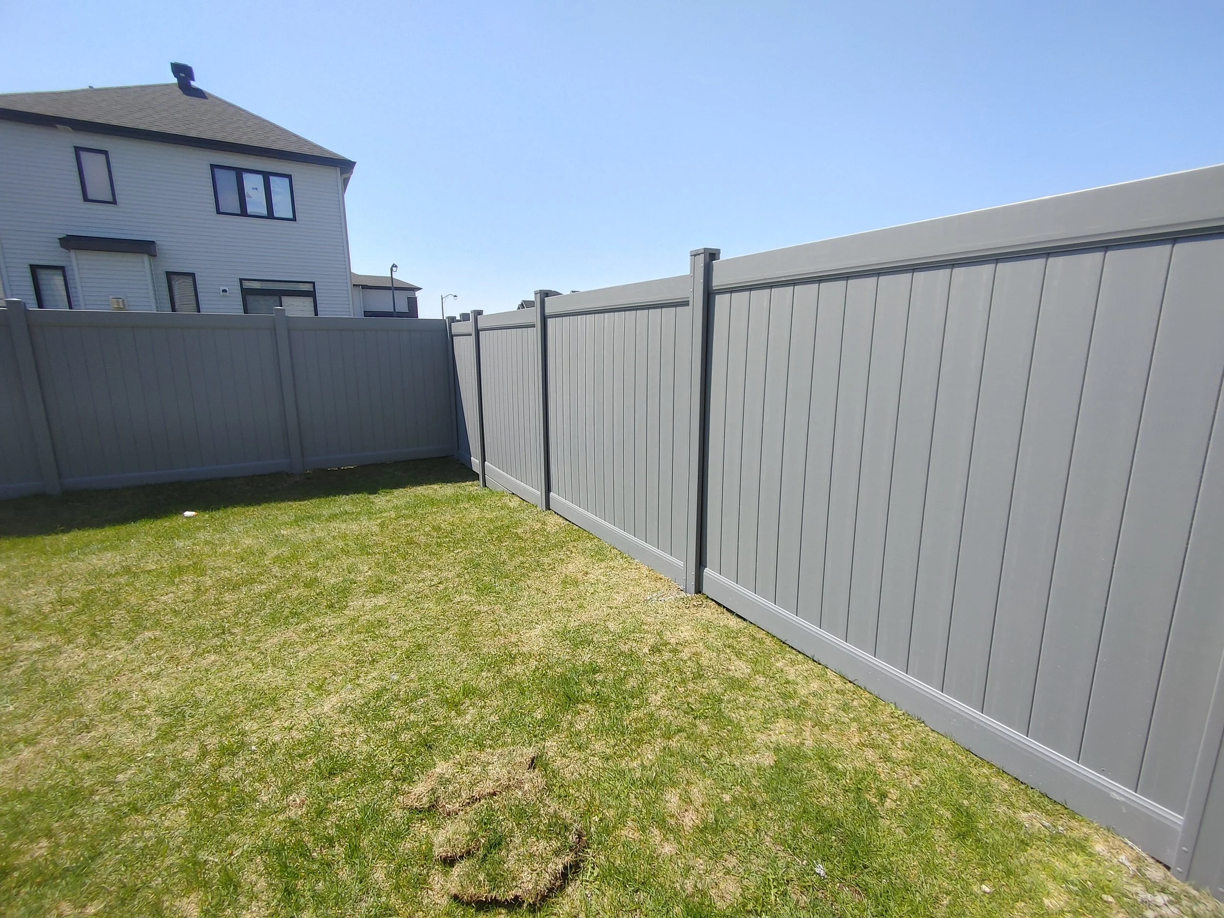 Grey PVC Fence in Barrhaven, 2025. StandArt Fence 