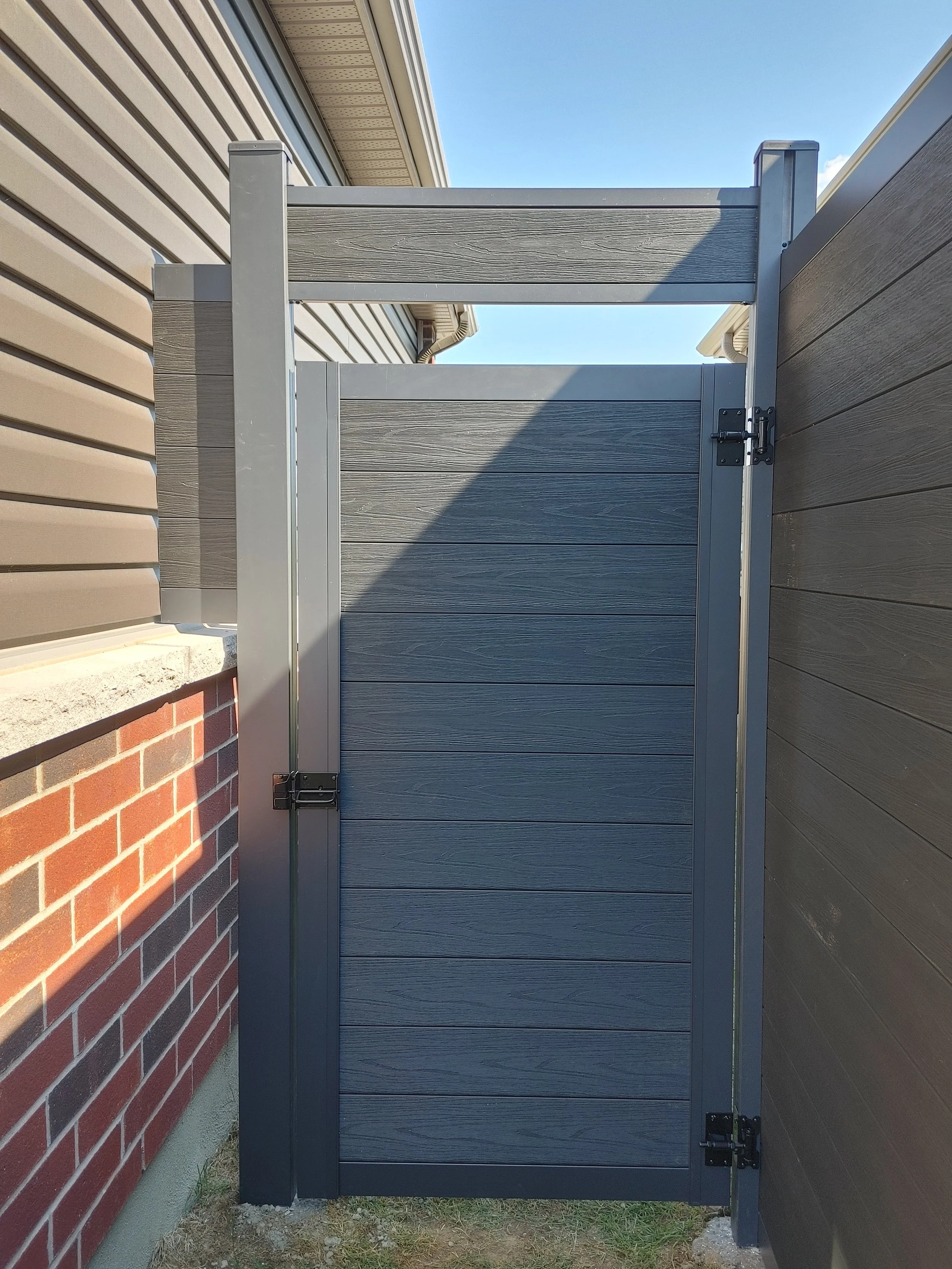 Black WPC Fence in Manotick, 2025. StandArt Fence 