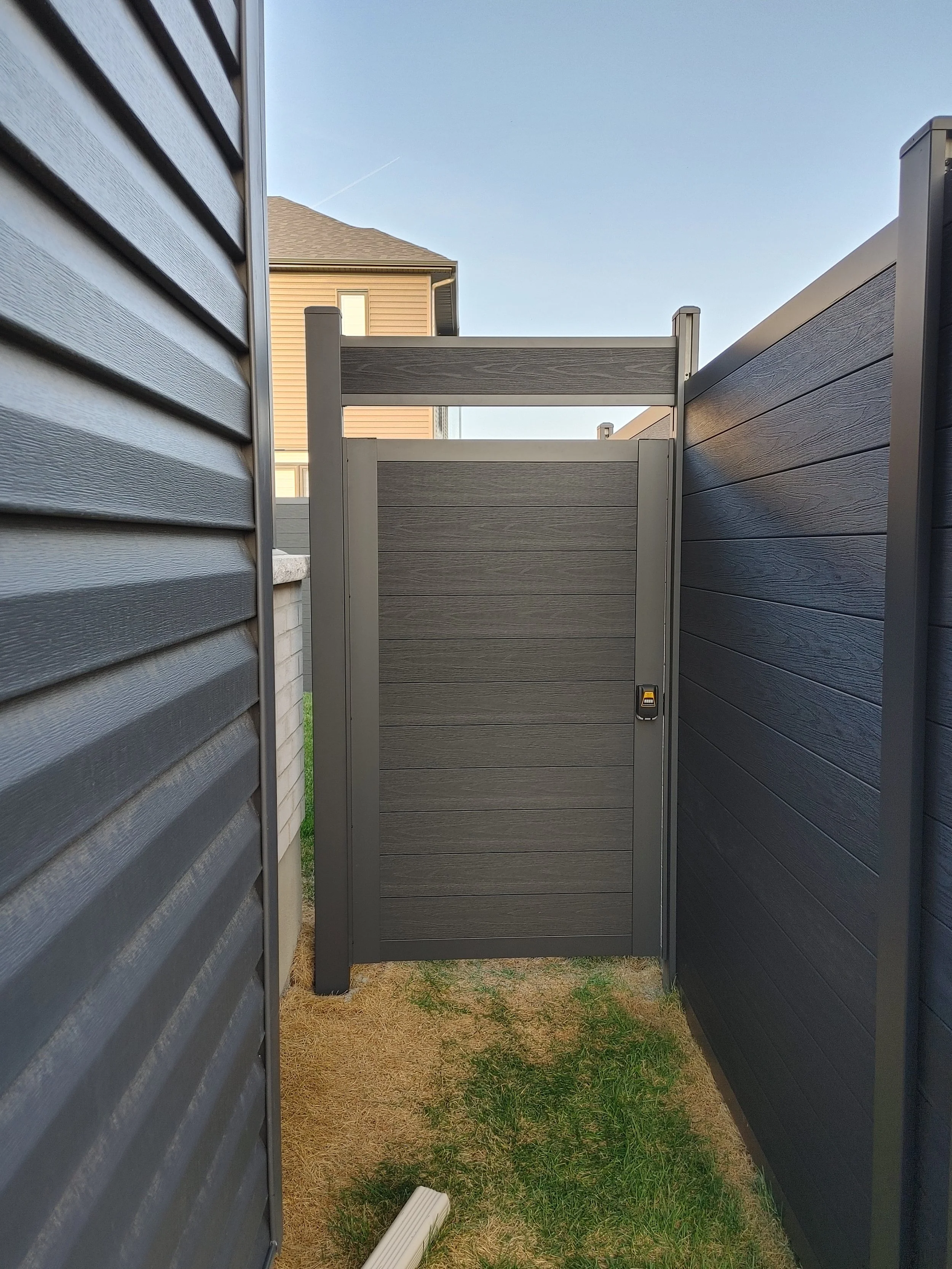 Black WPC Fence in Manotick, 2025. StandArt Fence