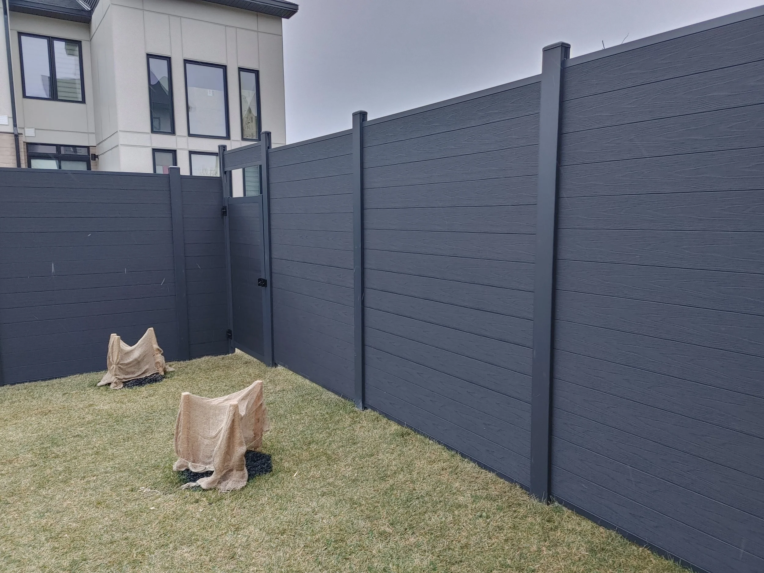 Black WPC Fence in Stittsville, 2025. StandArt Fence
