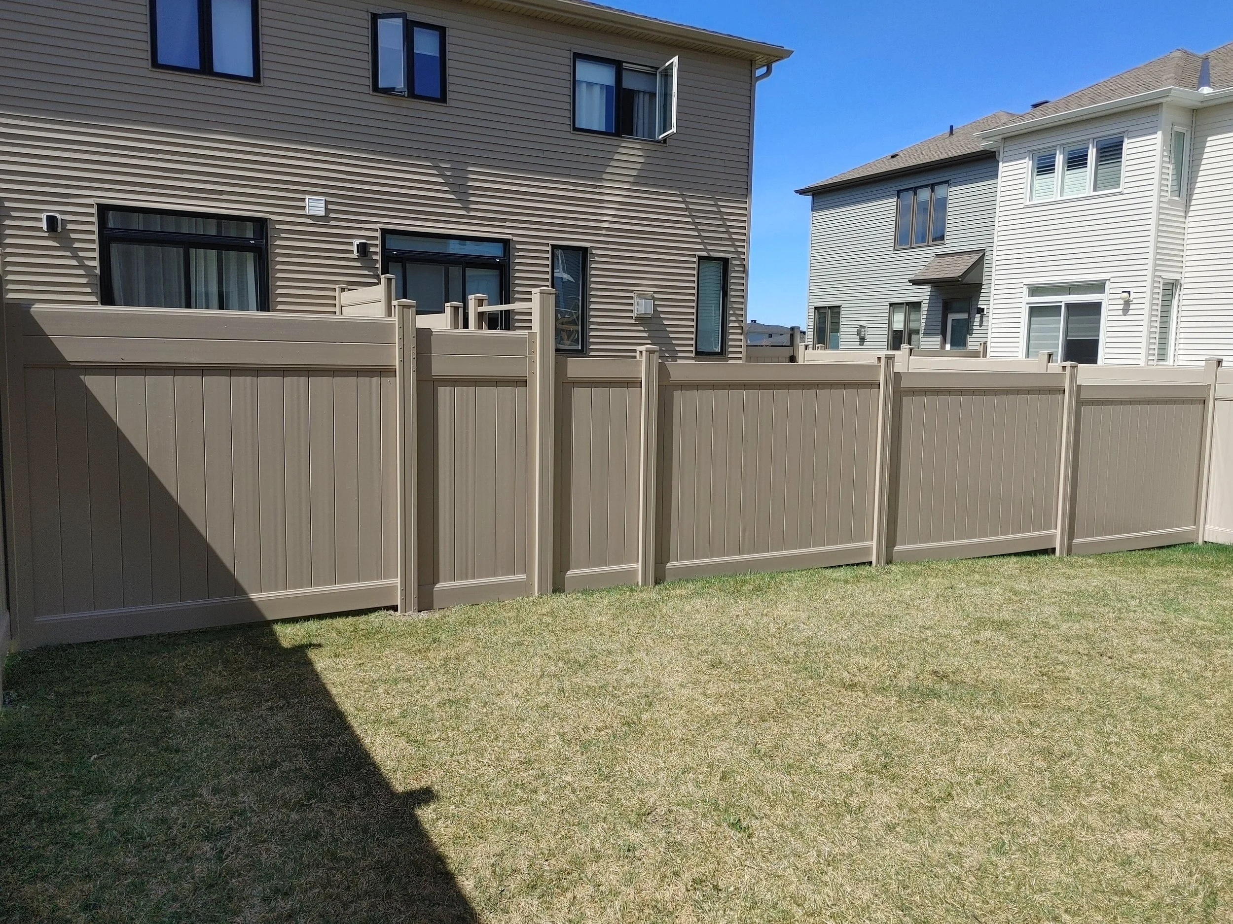 Grey PVC Fence in Barrhaven, 2025. StandArt Fence 