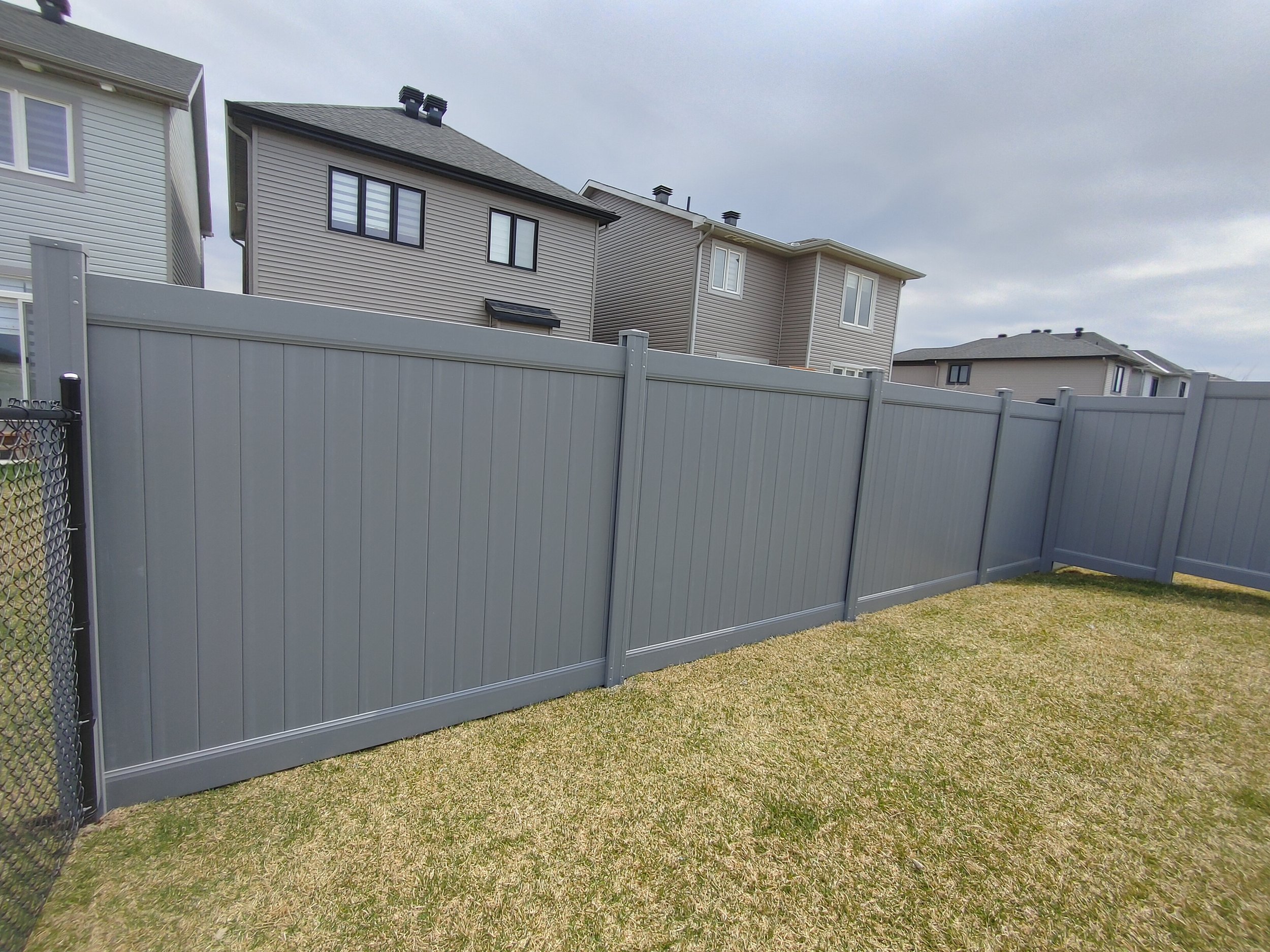 Grey PVC Fence in Barrhaven, 2025. StandArt Fence 