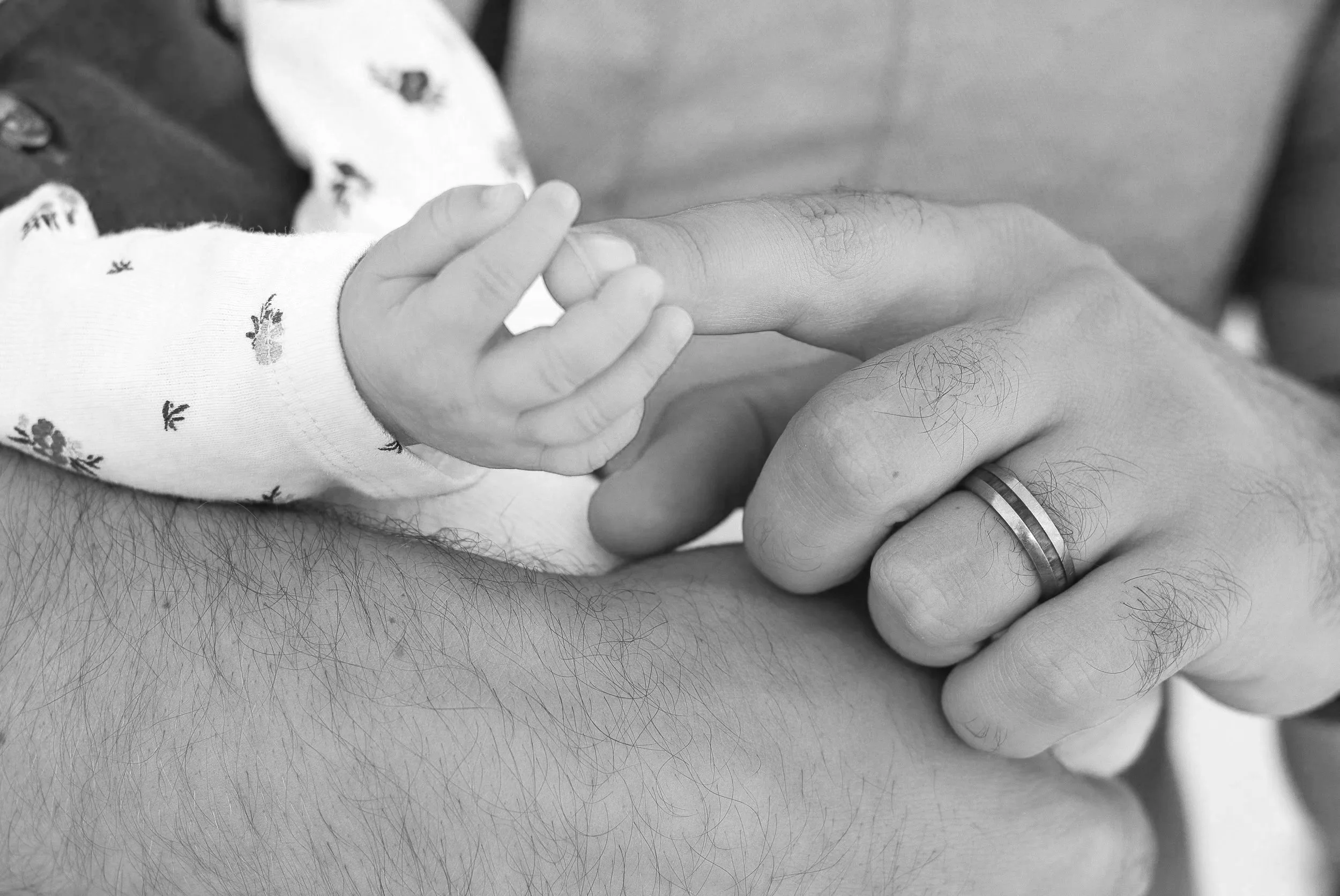 newborn baby girl with daddy portrait by a family photographer in the high desert.