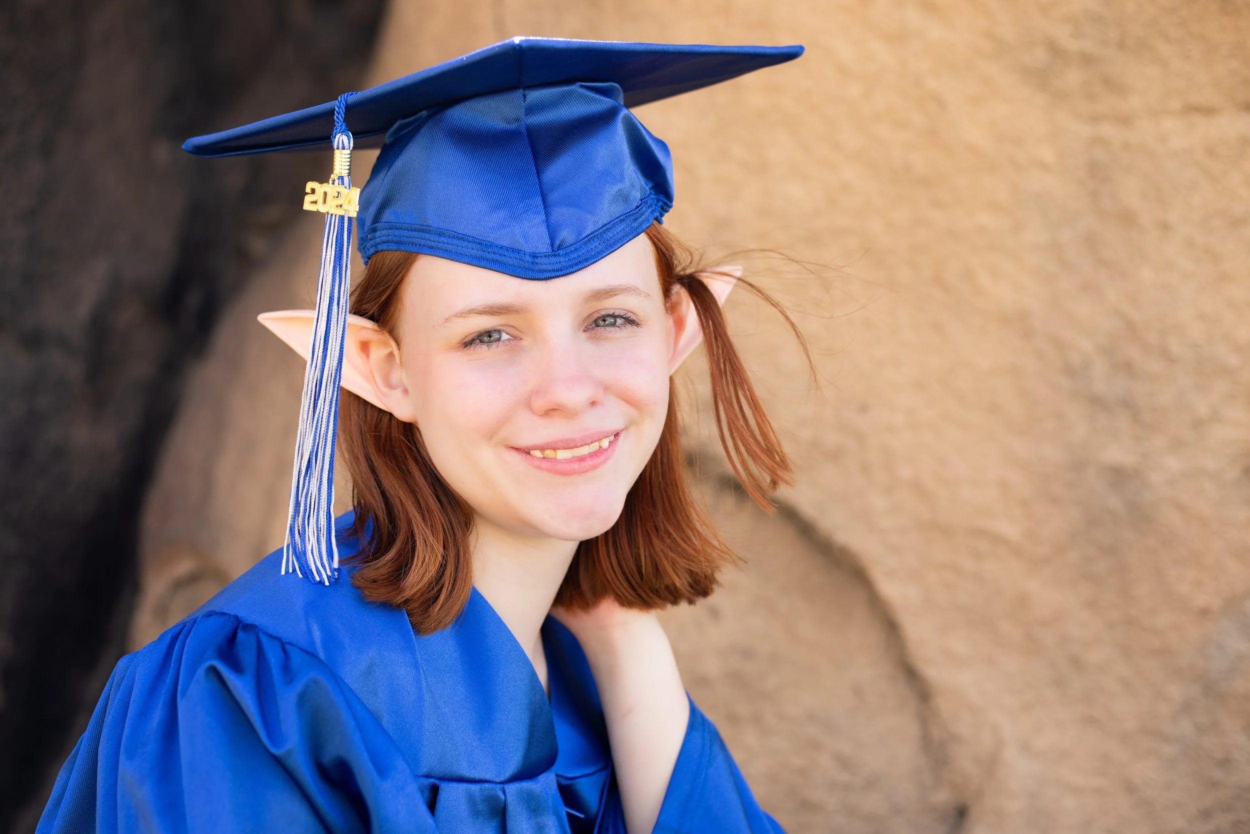 Fantasy photography for senior photo wearing cap and gown with elf ears. High desert, Ca and Inland Empire.