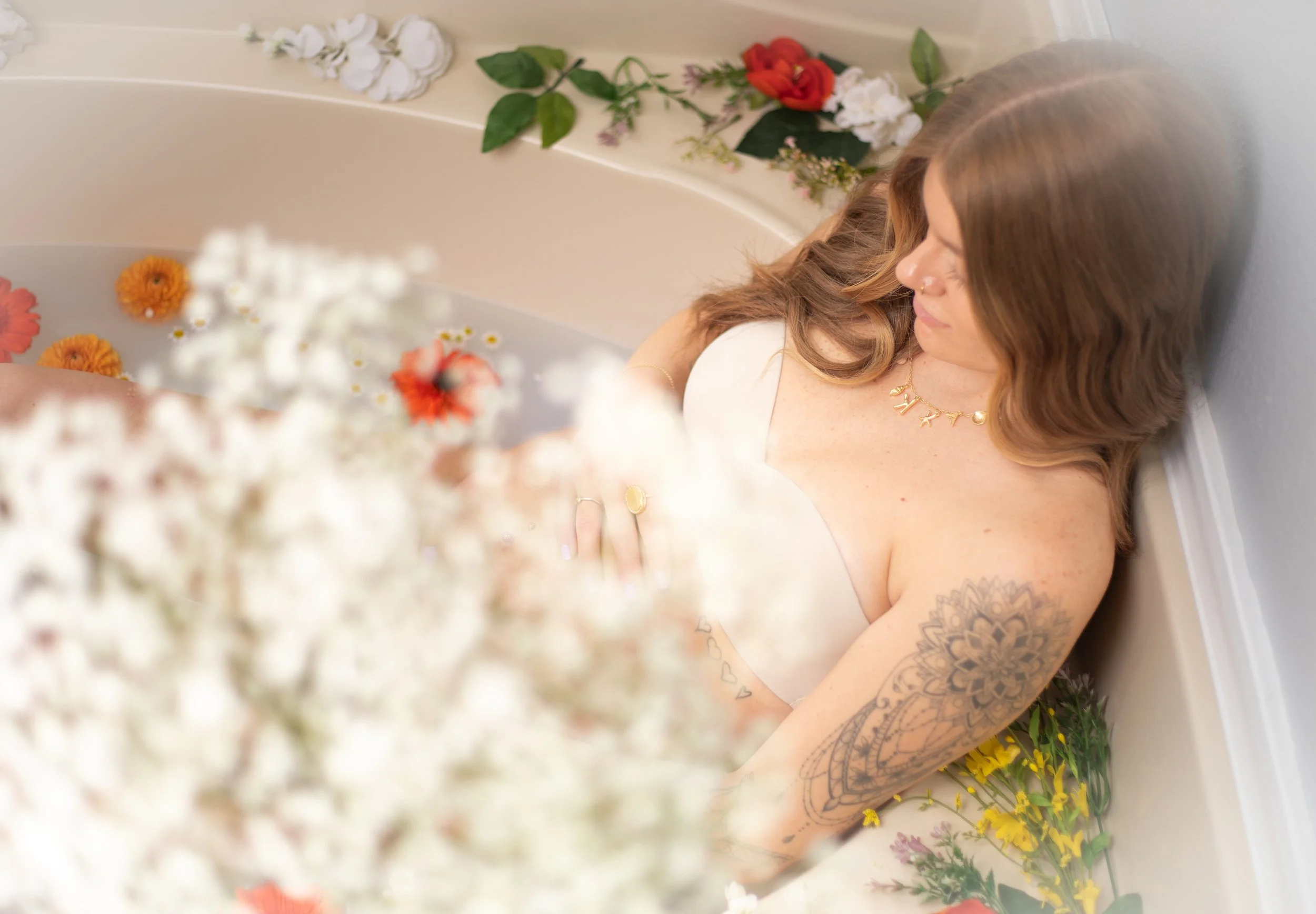 Maternity photos of woman in a milk bath in the high desert by portrait photographer.