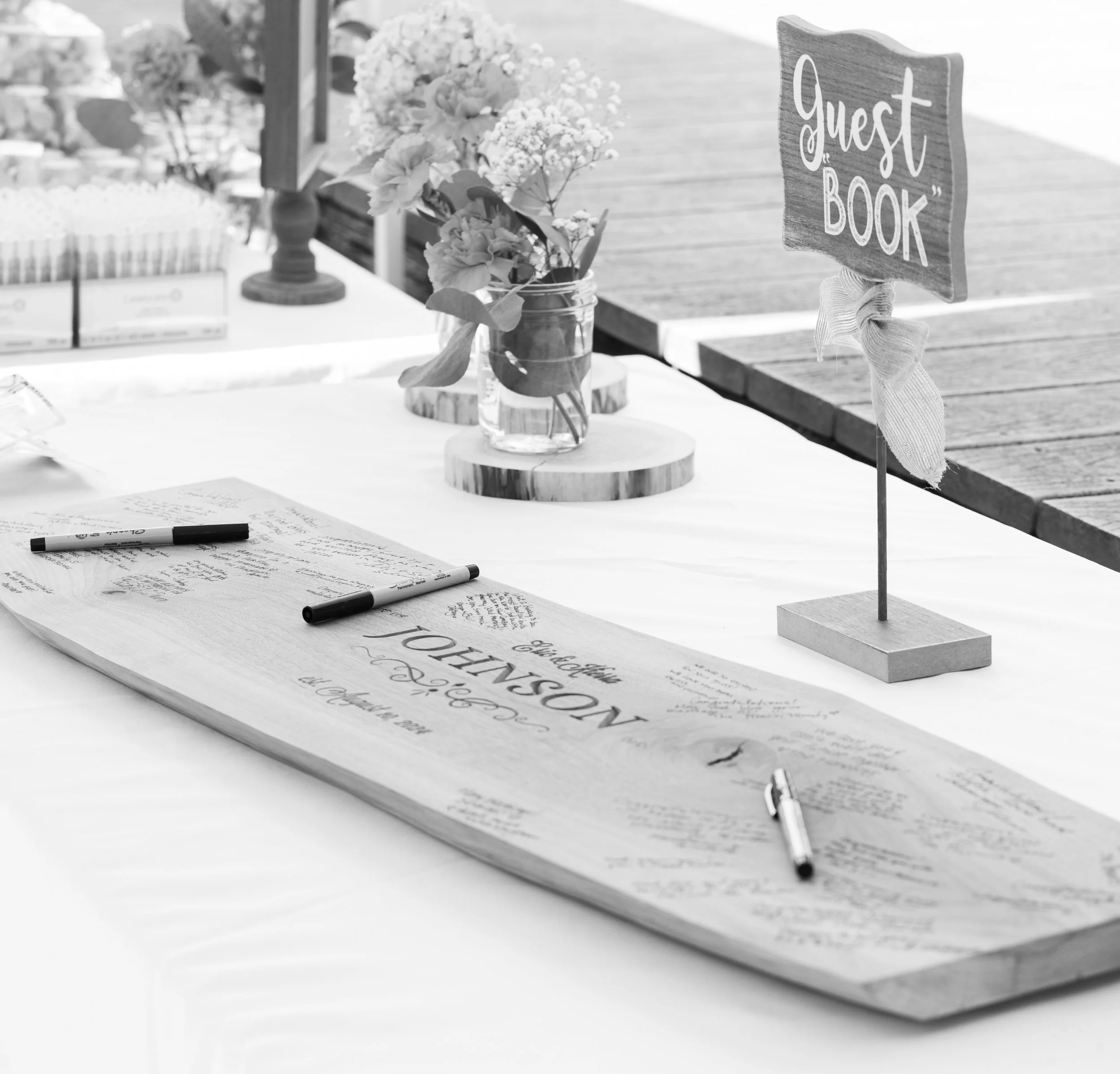 Guest book signing on a slice of wood. Very whimsical and magical for a unique wedding.