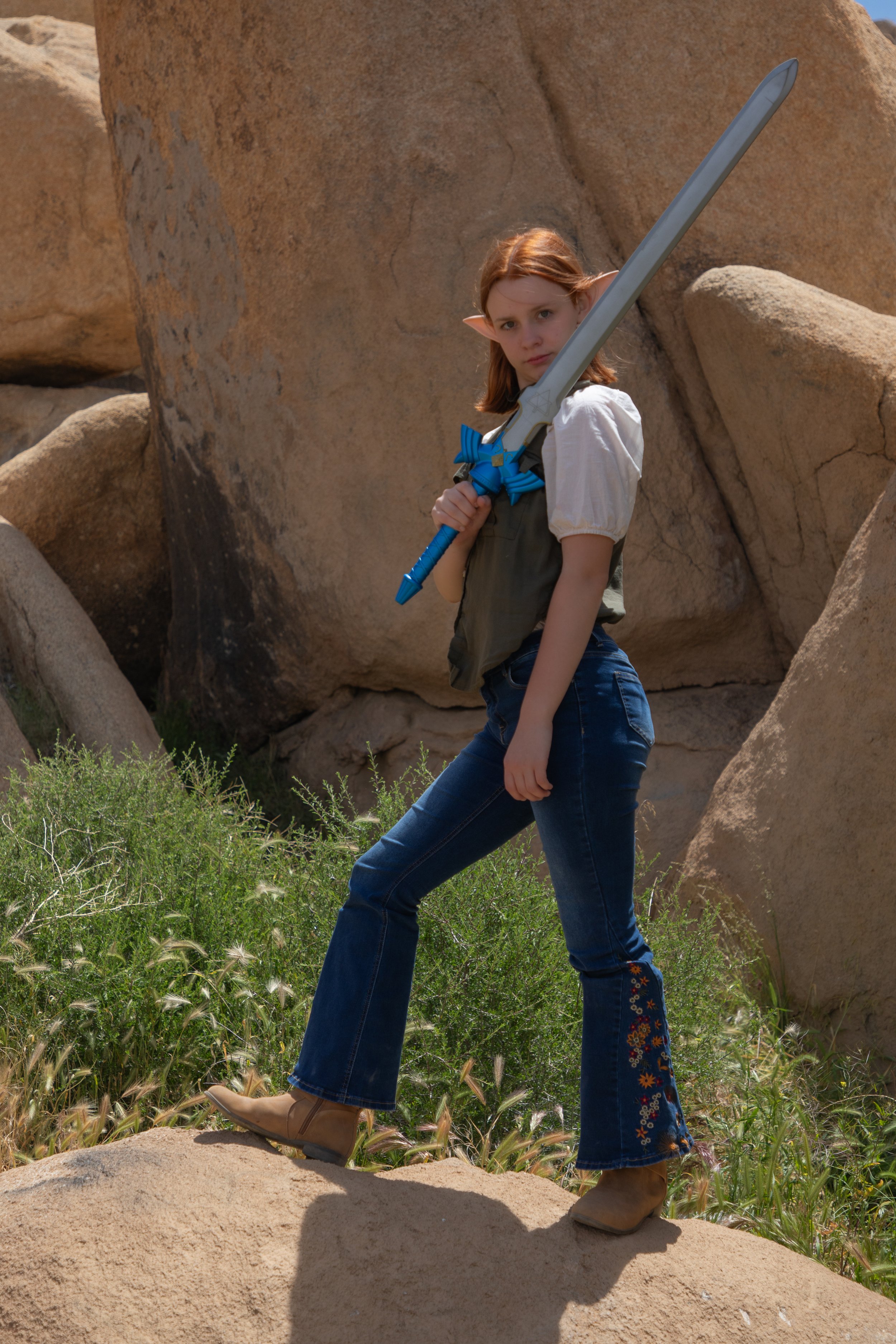Girl dressed in fantasy holding zelda sword. Cosplay and fantasy photographer in inland empire, CA.