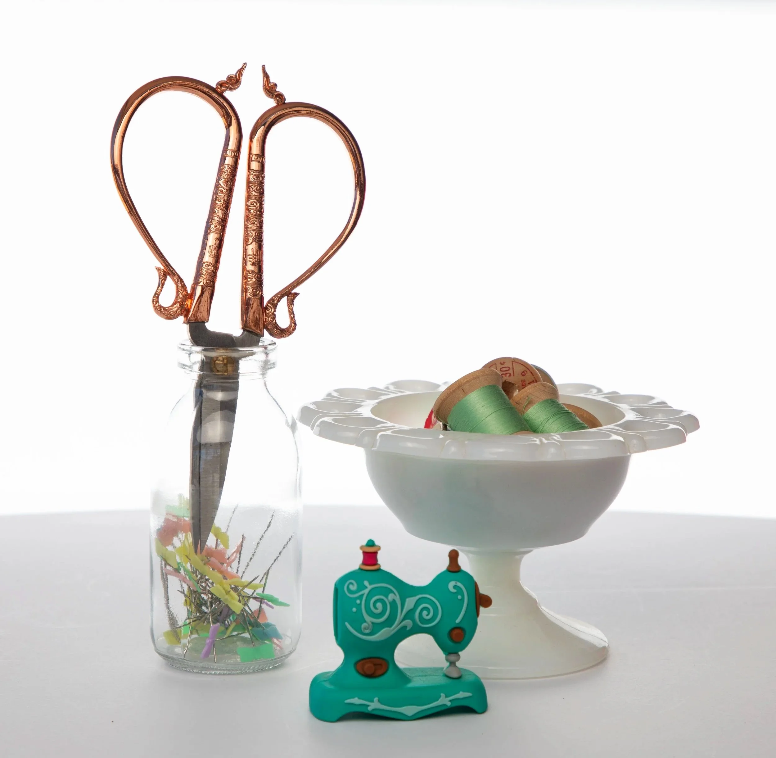 Scissors, pins, and sewing thread by family photograher in pinon hills.