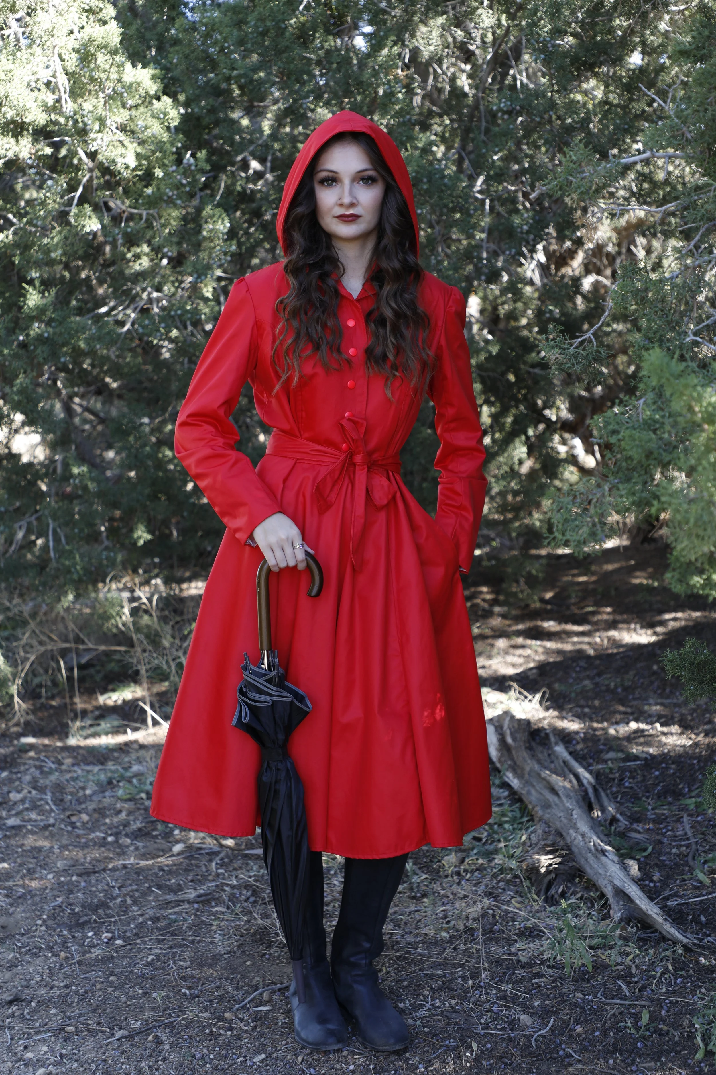 Annette marie photography, fantasy and fine art portraits. Red riding hood themed photo outdoors with woman holding umbrella.