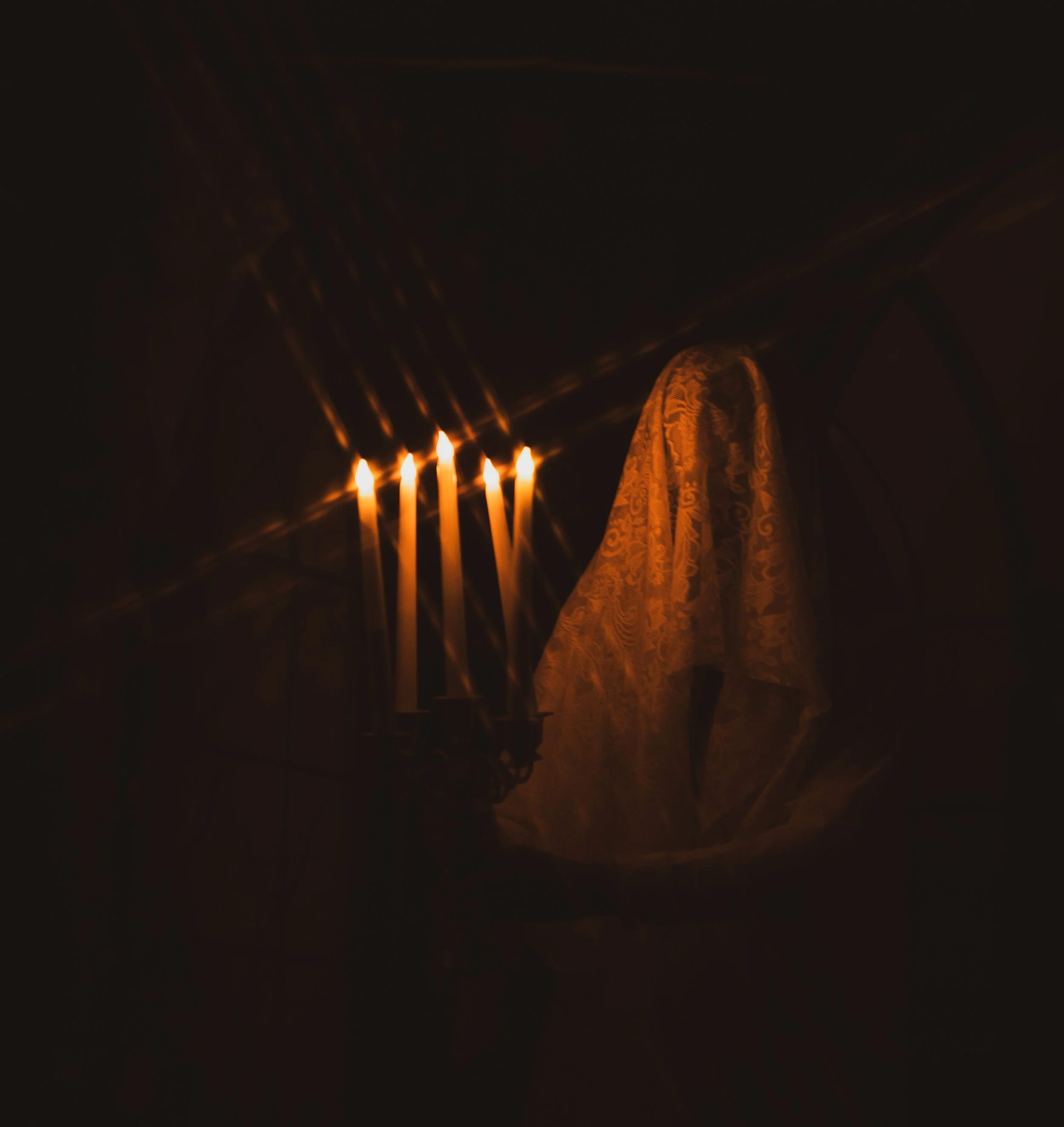 Woman in wedding dress, ghost bride carrying candles in the dark, fantasy fine art photography by annette marie in the high desert and inland empire, ca.