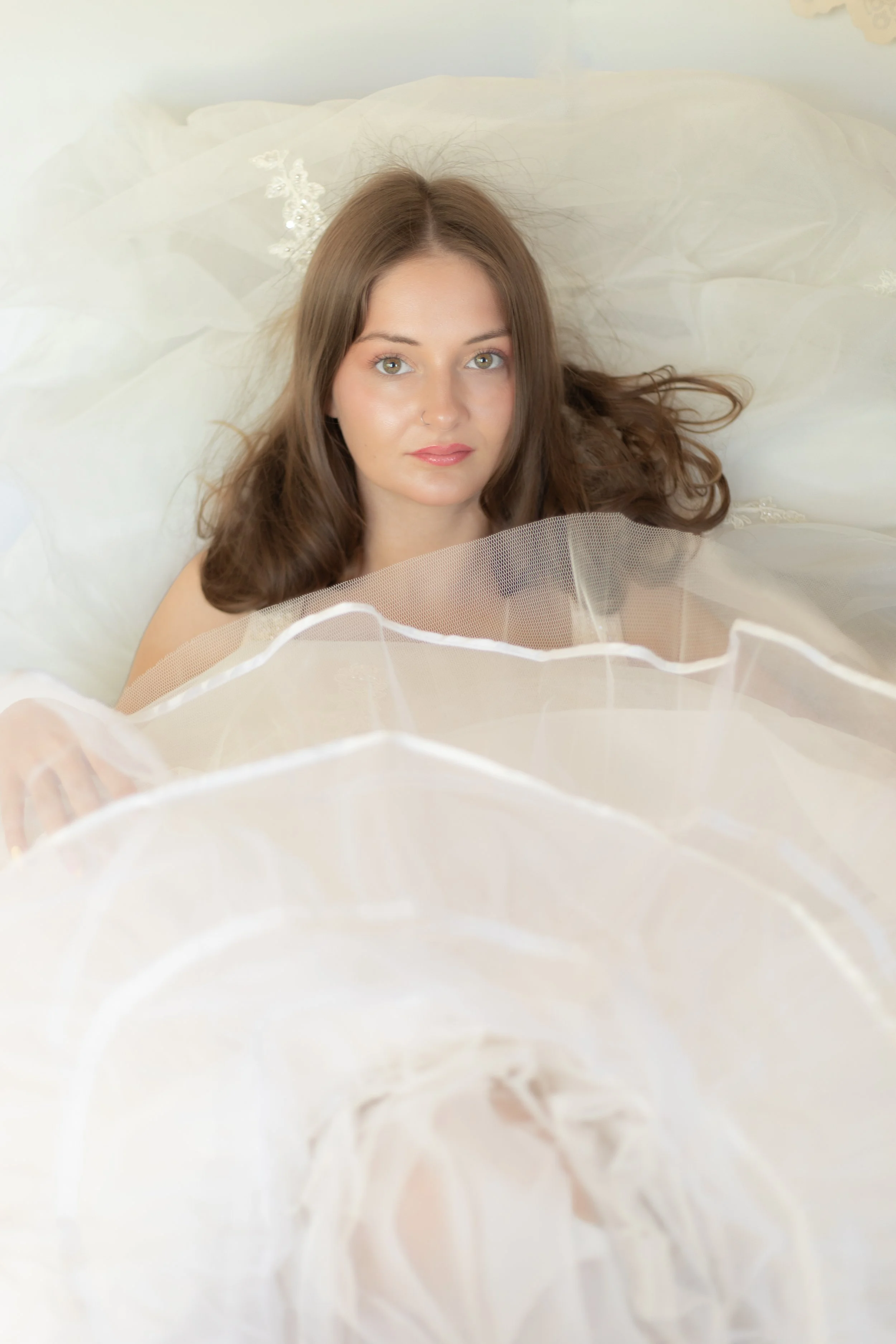 Fairytale portrait of woman sitting in white fabric by Annette Marie photography fantasy style in the inland empire.