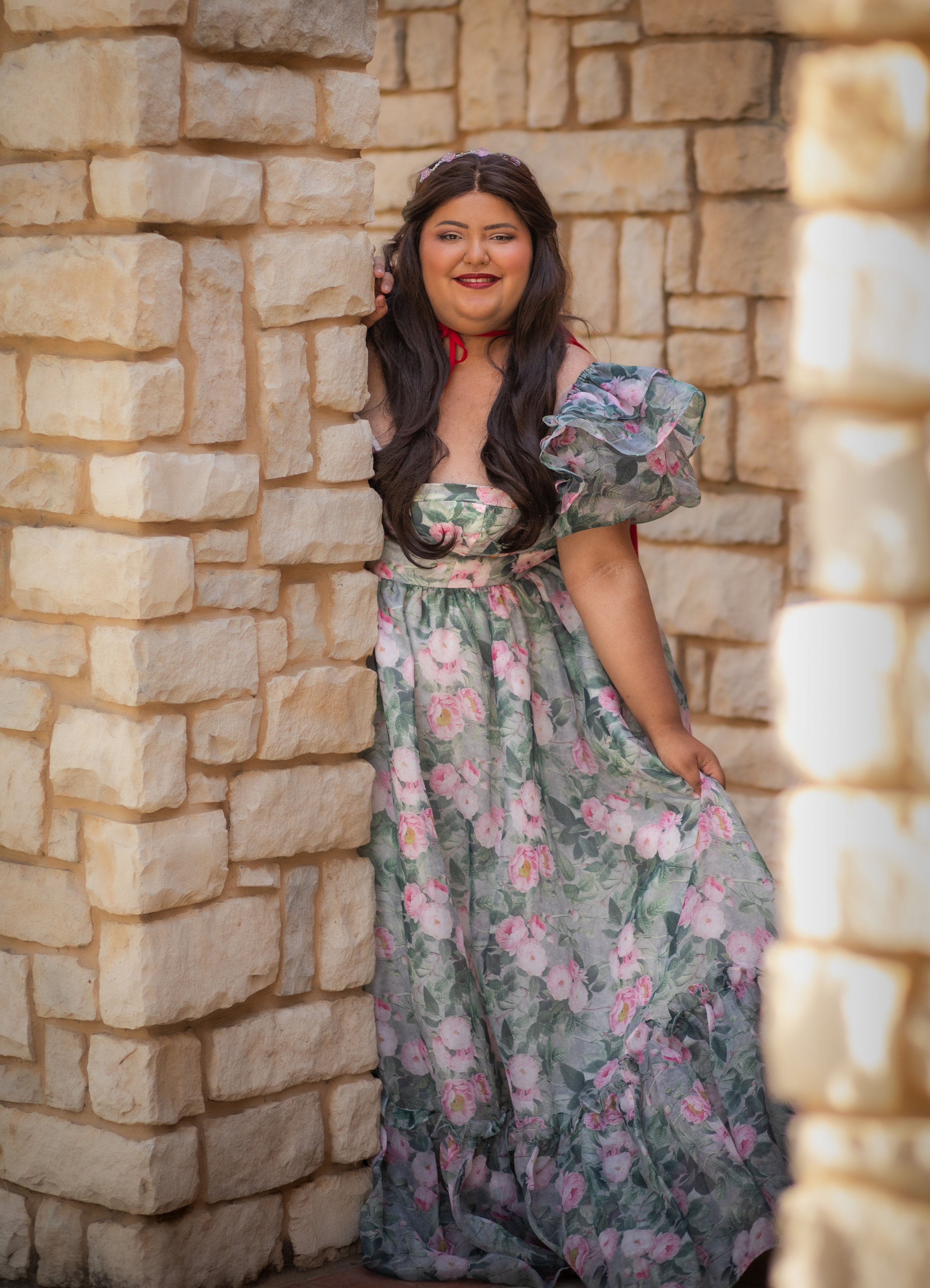 Woman dressed for a fairytale portrait session leaning against a castle wall. Fantasy photos by annette marie in the high desert and inland empire, Ca.