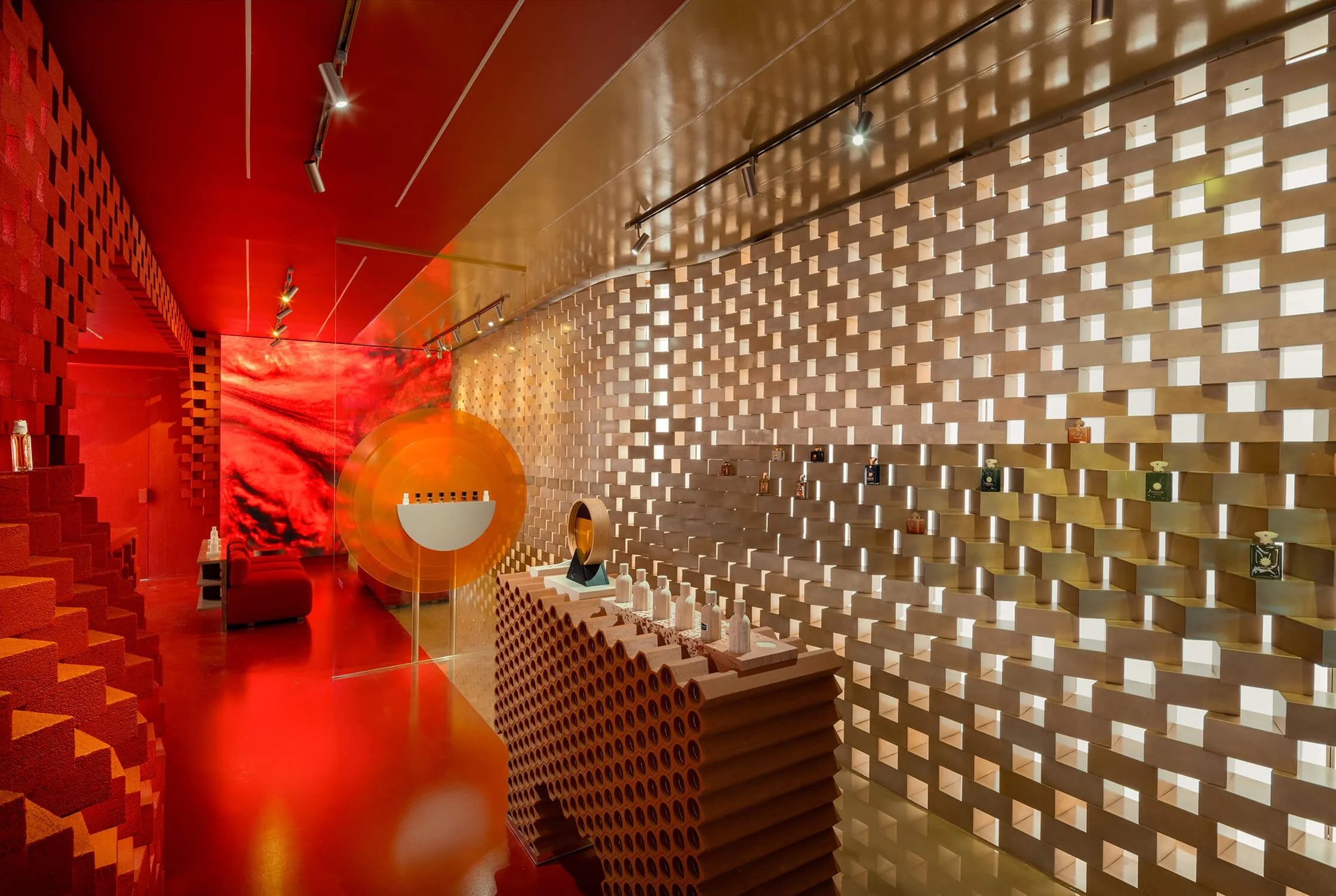 Geometric lighting and textured walls at Amouage Soho, photographed for The Retail Archive, retail store photographers.