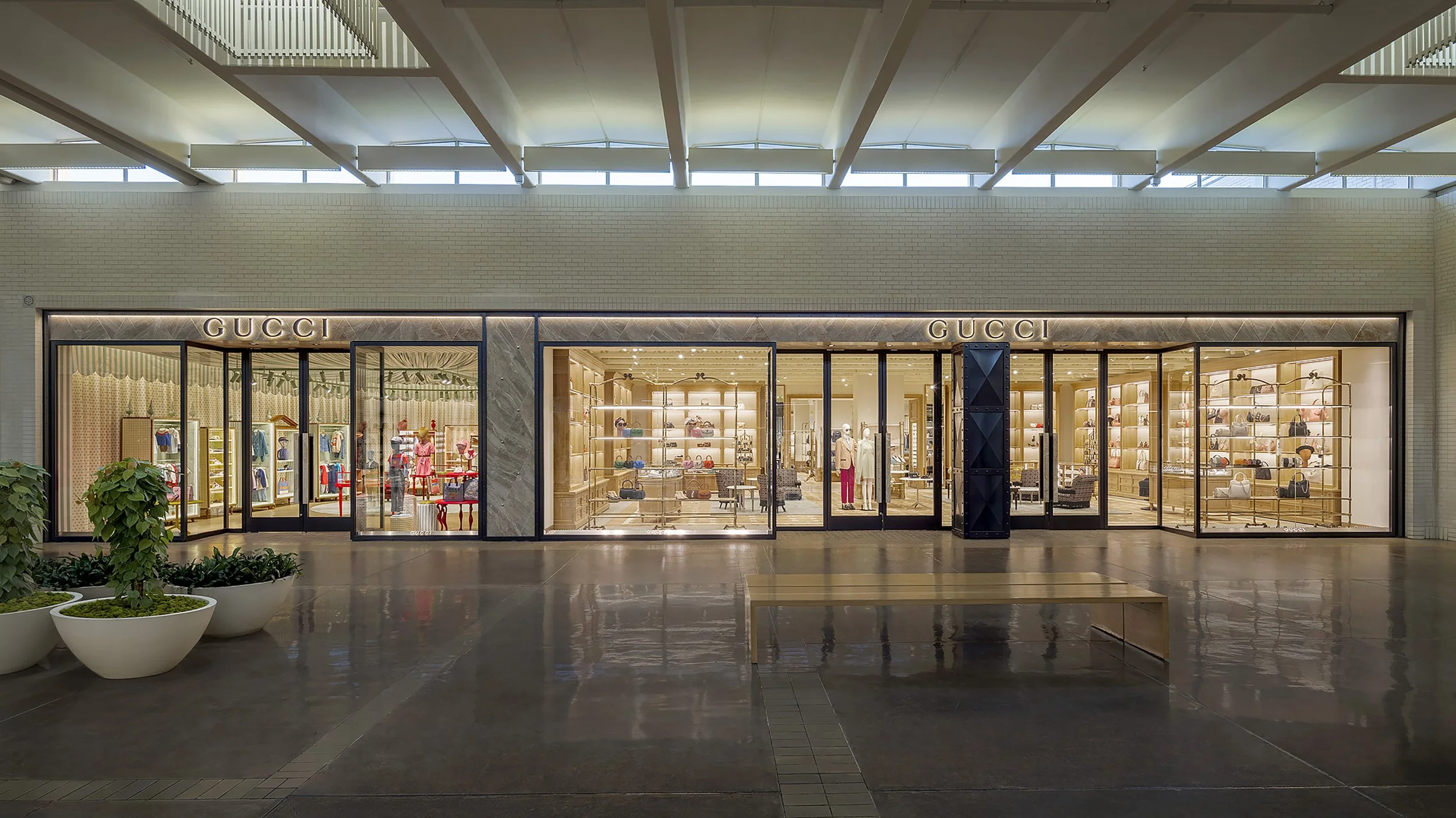 Lobby view looking toward the window displays of the Gucci retail store. 