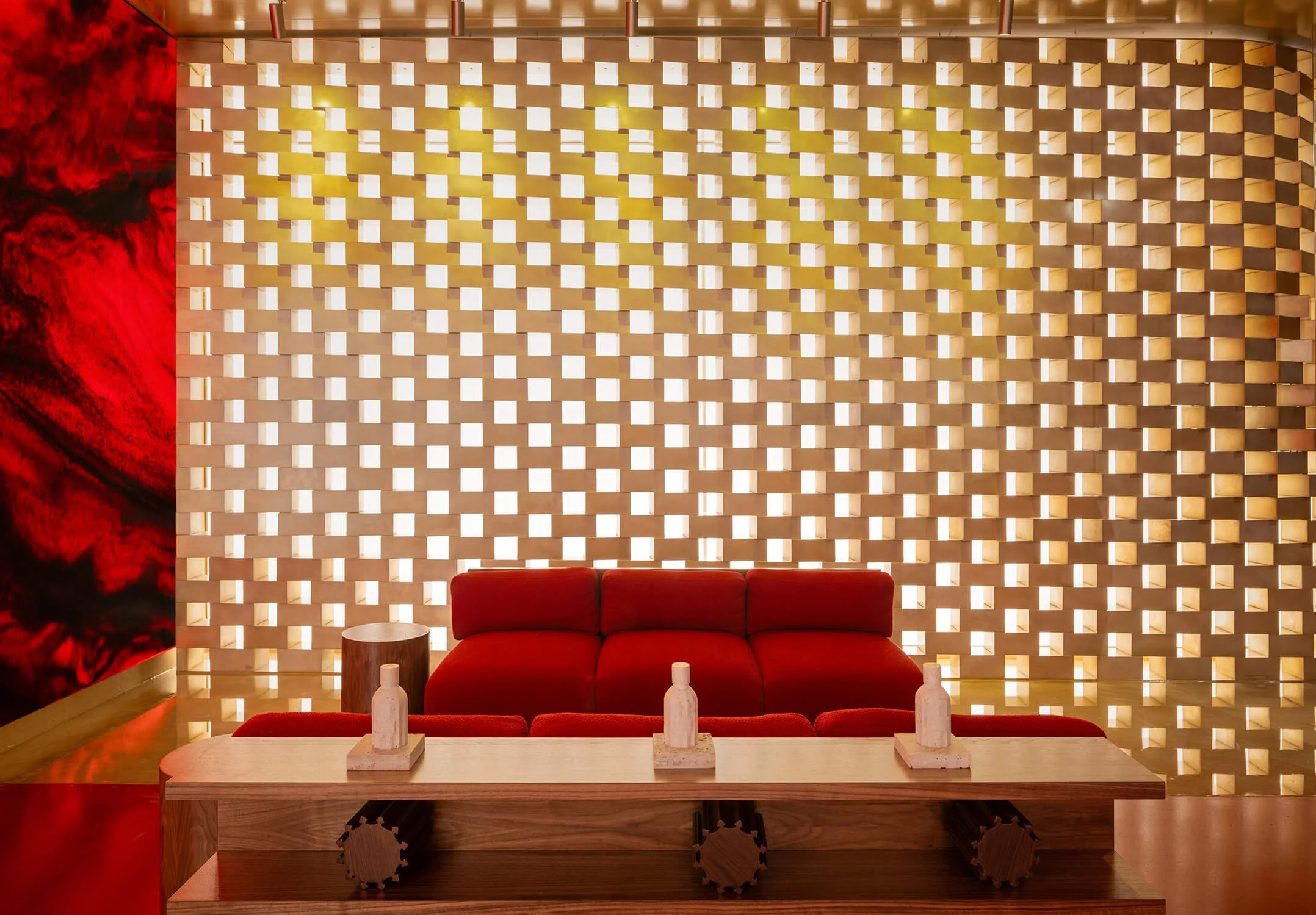 Red lounge area at Amouage Soho store photographed by The Retail Archive, retail store photographers.