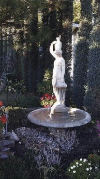 Photograph of sculpture in the yard of Dalley home. Wes and Geraldine Dalley purchased the home known as the Thomas Austin home in 1975.
