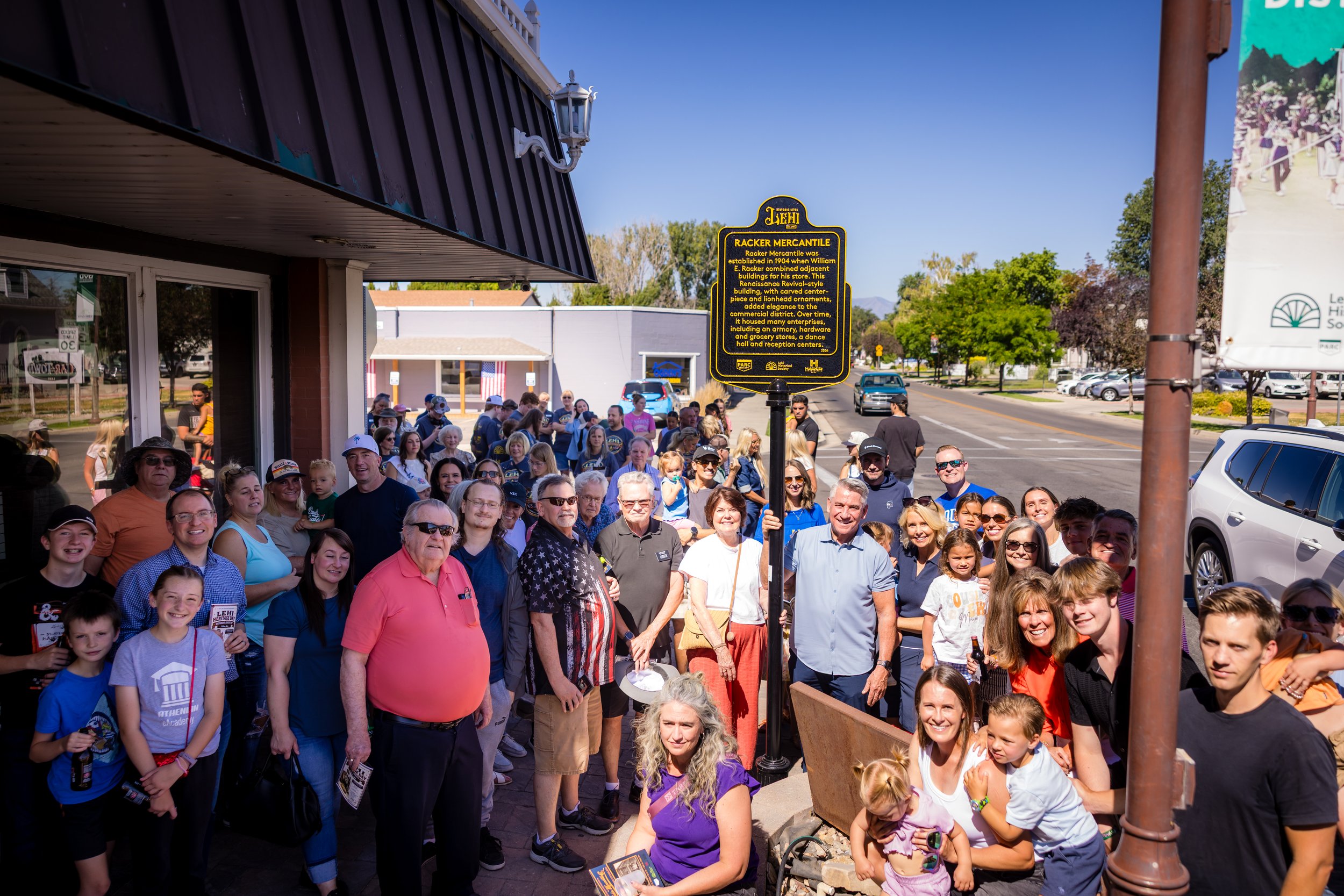 Descendants of William E. Racker pose with the Racker Mercantile historical marker that was unveiled on July 11, 2026.