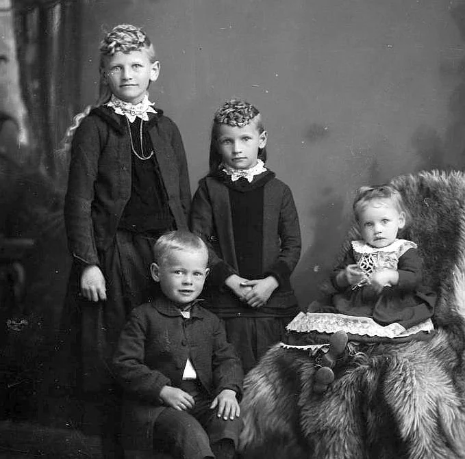 Christian Knudsen's children 28 March 1890, Laura Hannah Mary Knudsen, left, Christian Gilbert Knudsen, Carrie Elizabeth Knudsen and Alice Catherine Knudsen .jpg