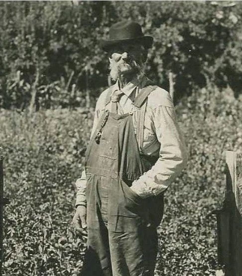 Christian Knudsen in front of his garden. Retrieved from Family Search