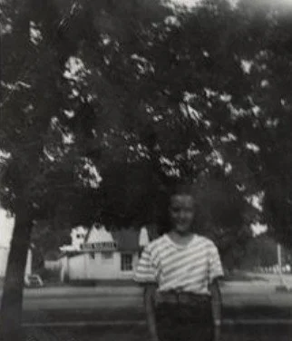 A black and white photograph of Janice Adamson (Peck) at Wines Park in 1948.