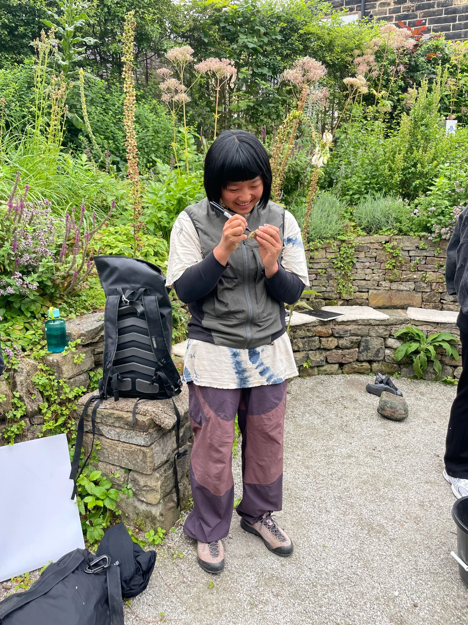 woman signs rock