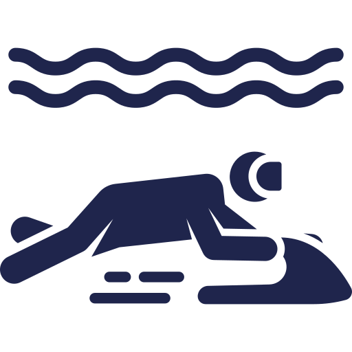 Silhouette of a person floating in water during a night swim