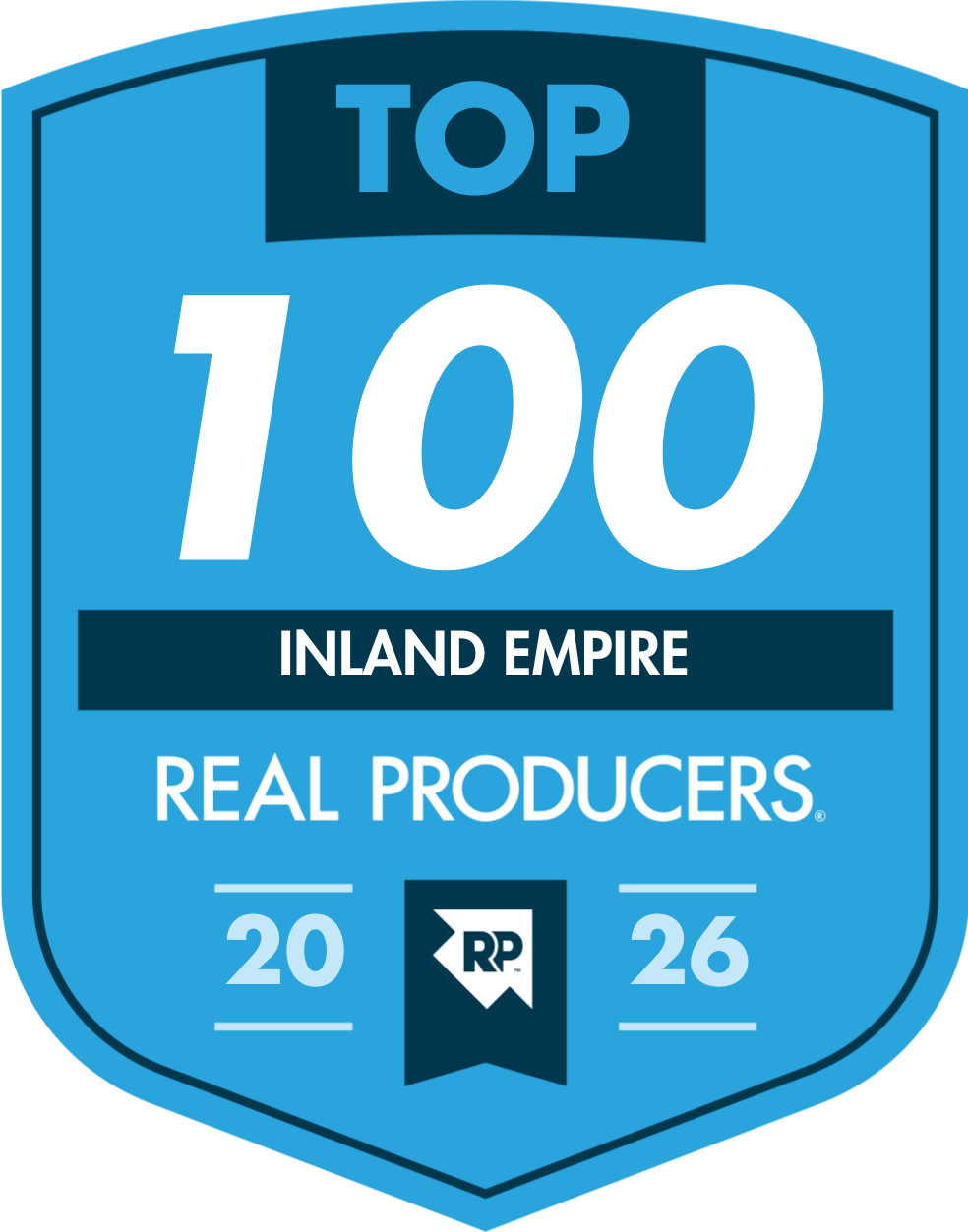 A badge-style graphic with a blue background and dark blue accents, displaying the text 'TOP 100 INLAND EMPIRE REAL PRODUCERS 2026' with a logo at the bottom center.