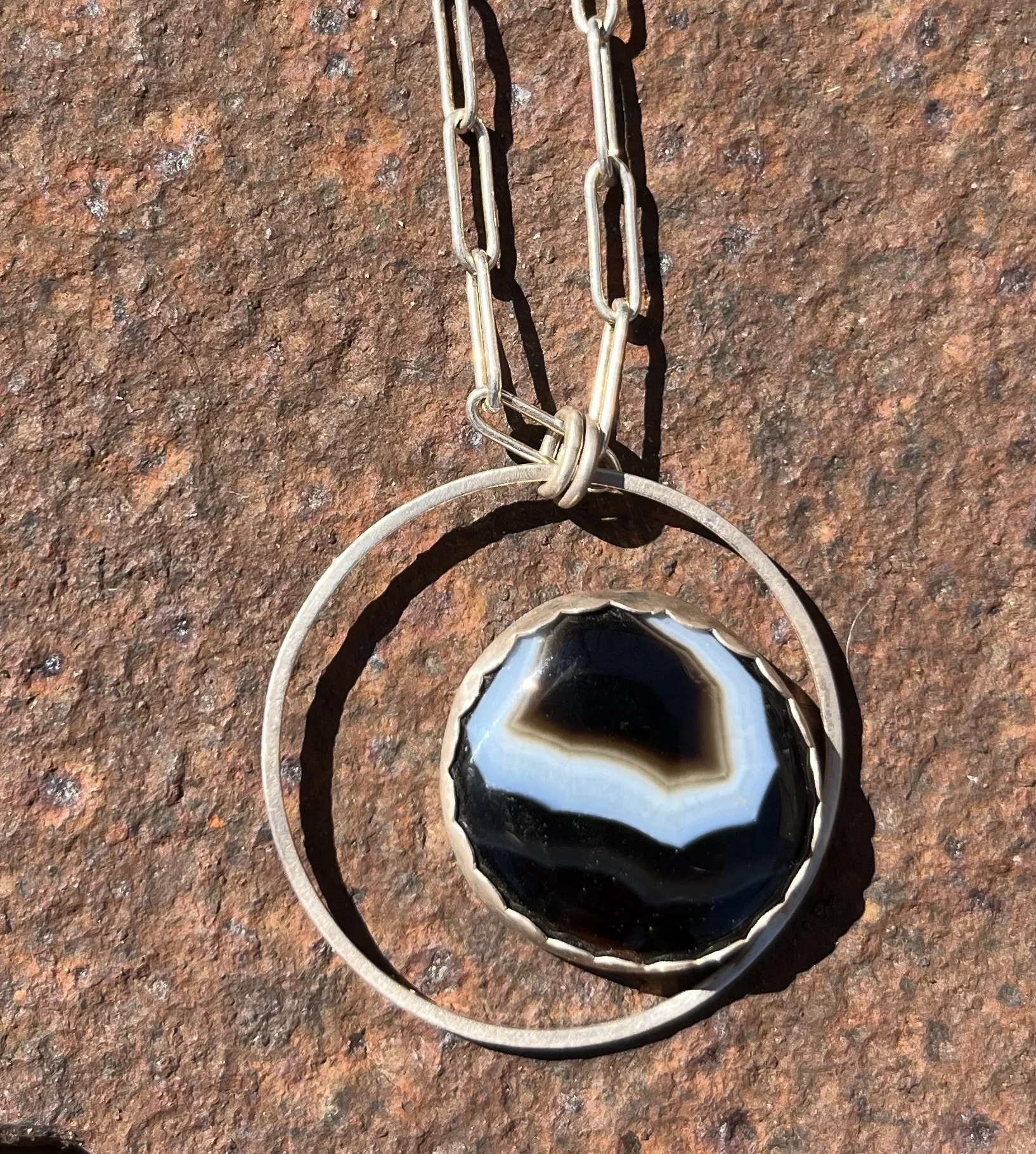 Circle with Sardonyx on 18" sterling silver paperclip chain