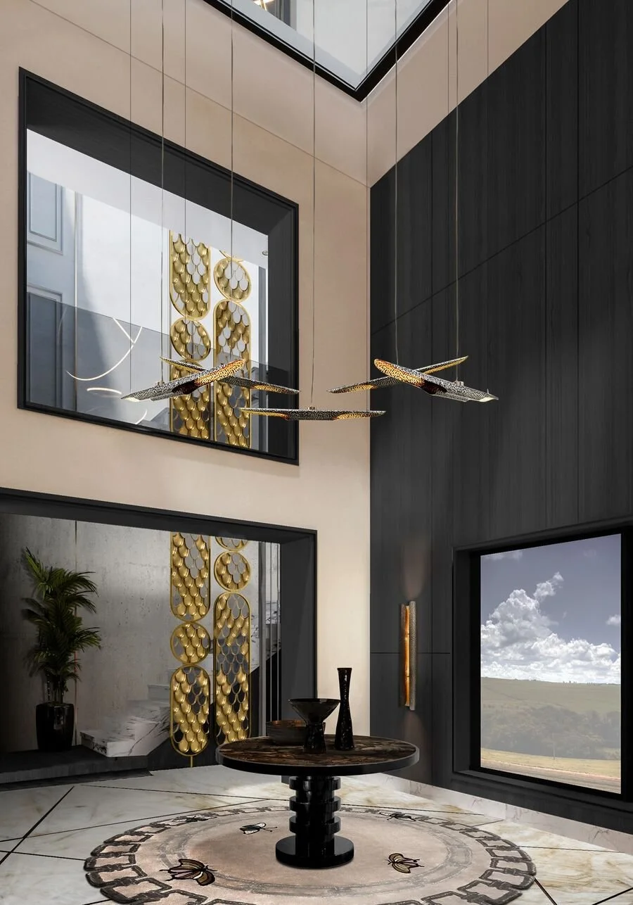 Modern interior with large mirrors, decorative lighting, round table with vases, large windows, and abstract gold wall art.