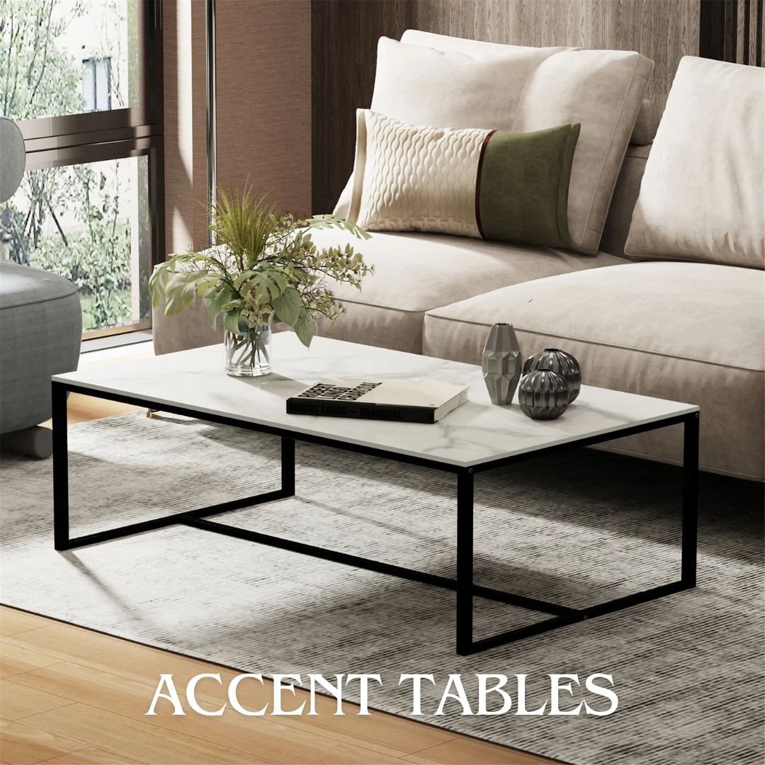 Modern living room with a marble-top accent table, beige sofa, decorative pillows, and a vase with greenery on the table.