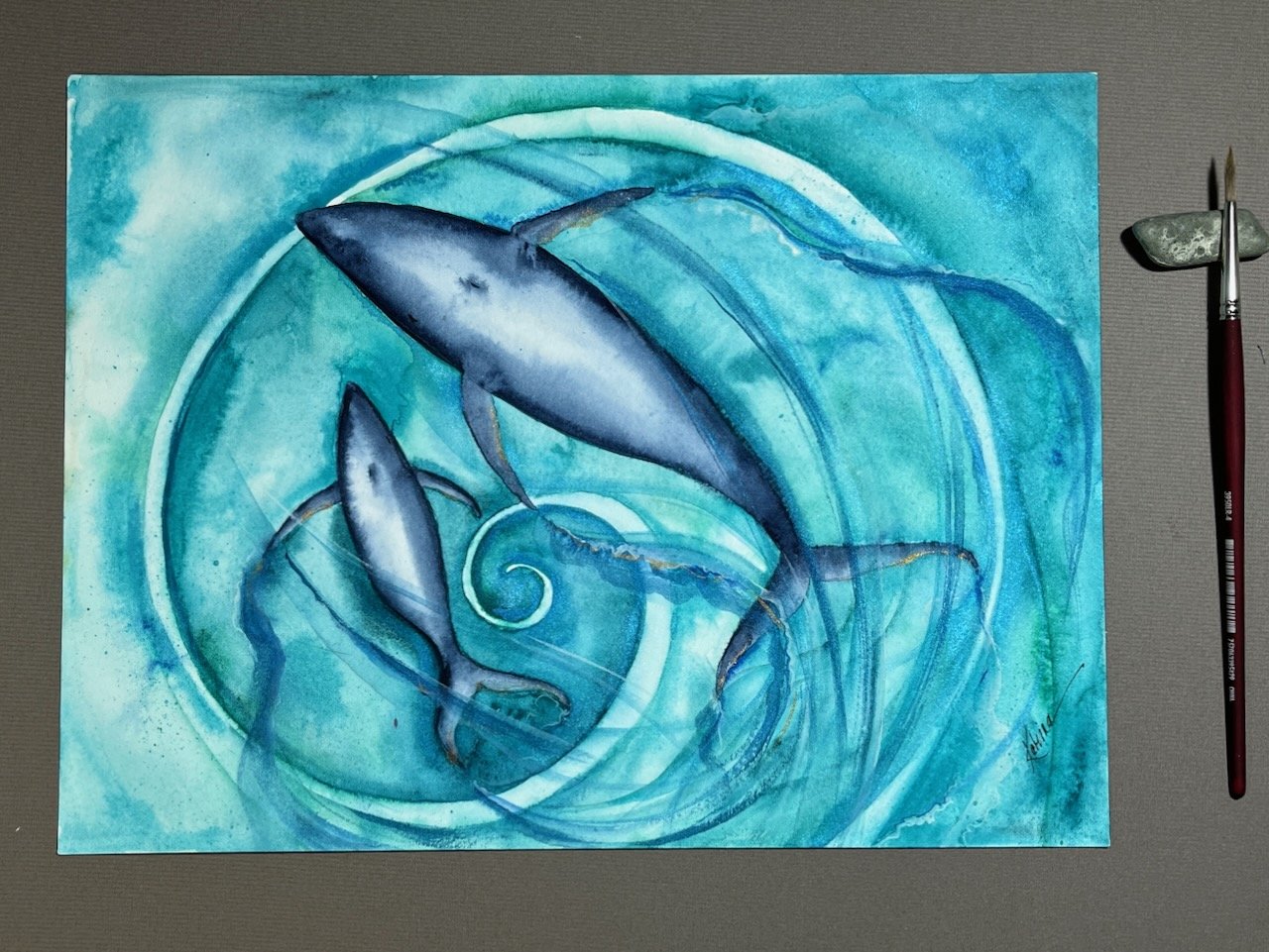 Katrina-Meister-baby-Whale-Dance-Spiral-watercolor-painting-deskshot.jpeg