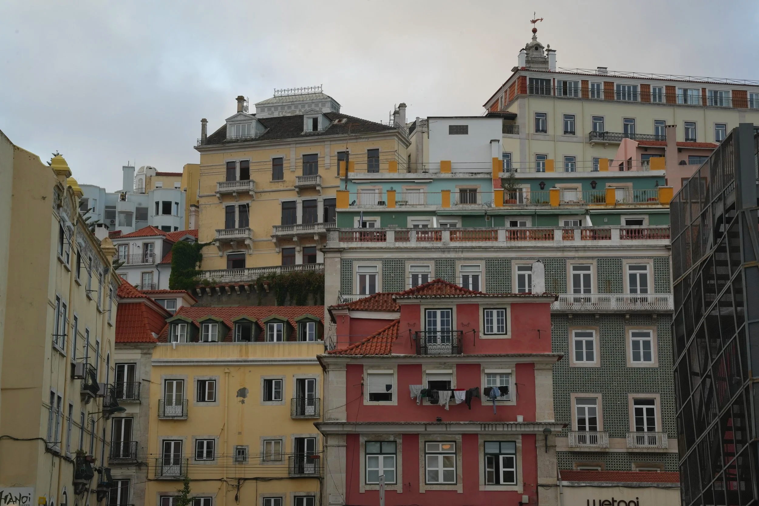 Jade's camera captures colorful overlapping buildings constructed up Lisbon's steep hills. 