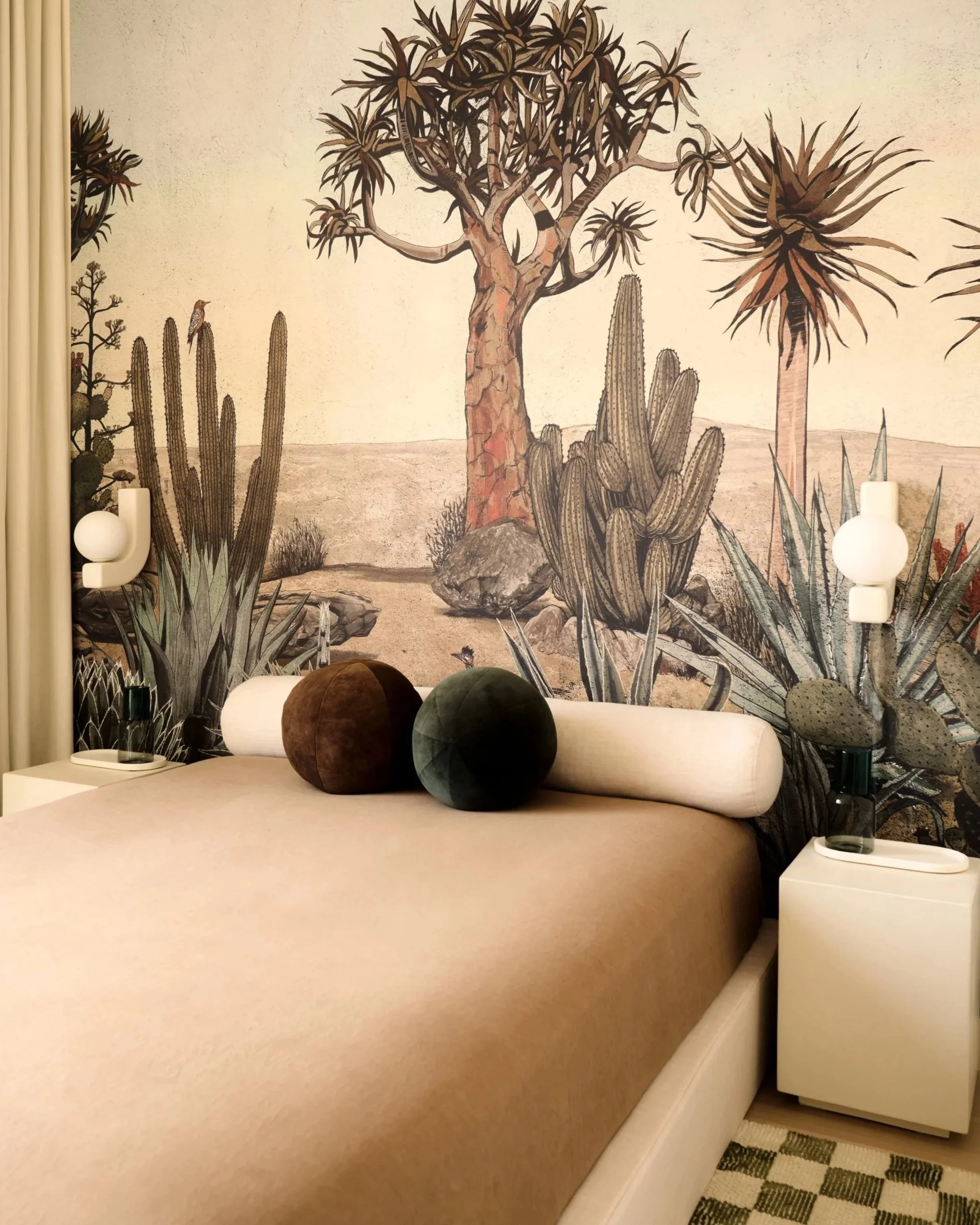 Brooklyn penthouse guest bedroom featuring a hand-painted desert mural and antique dresser.