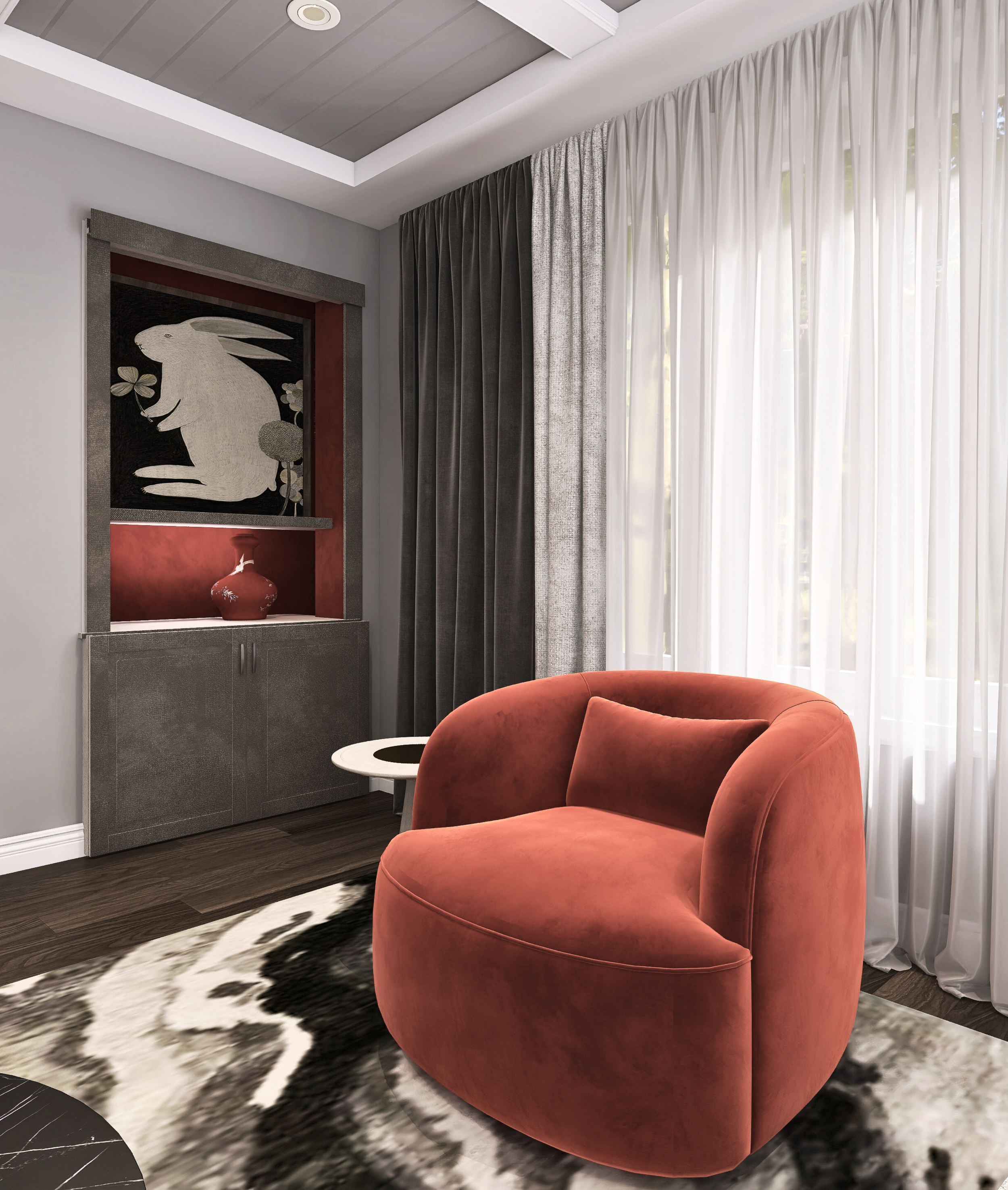 A cozy living room corner with a plush, red-orange velvet armchair, black and white patterned rug, white side table, and floor-to-ceiling curtains in white and gray. There's a built-in wall shelf with artwork of a rabbit and a red vase.