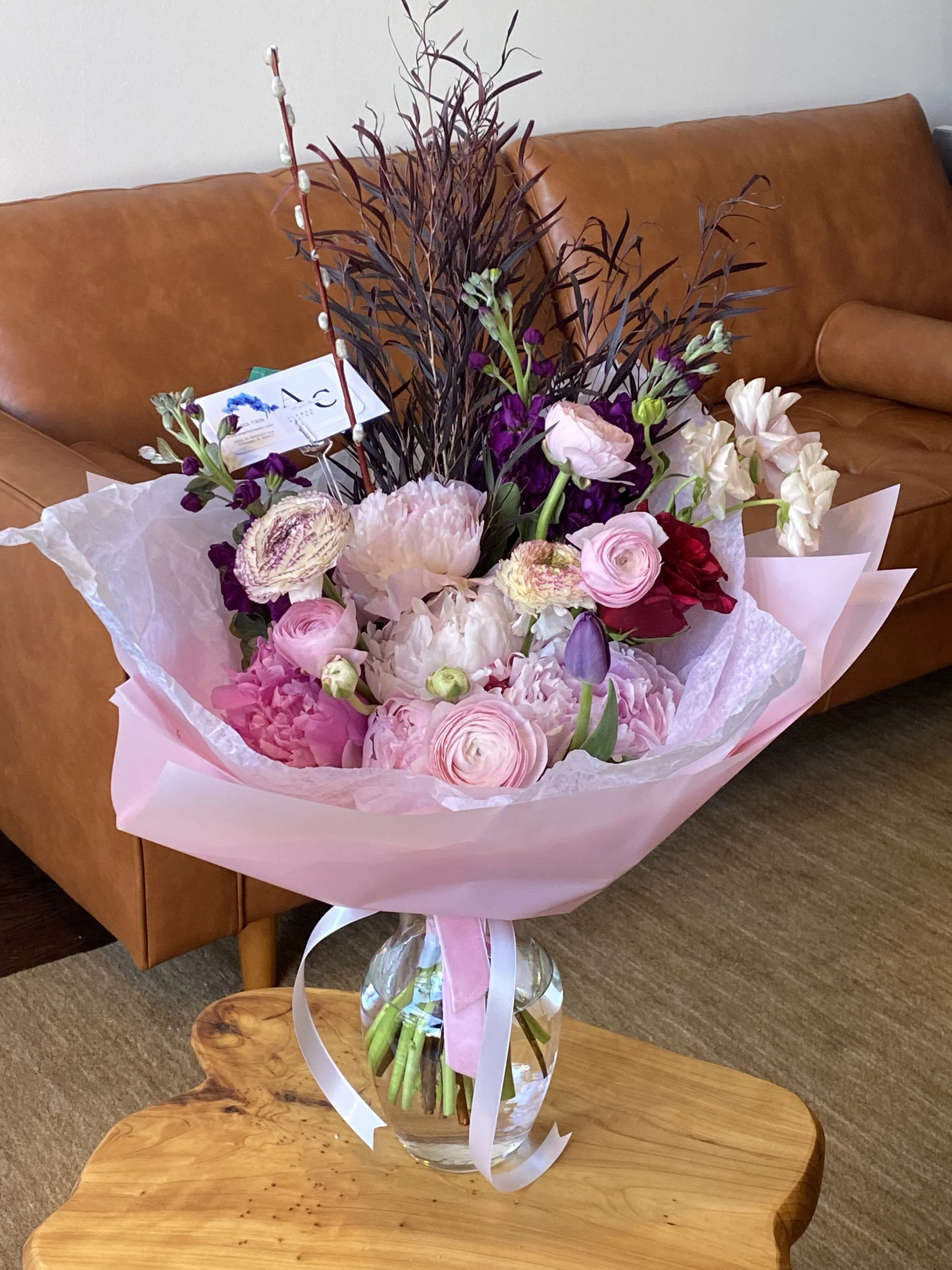 Pink and red flower arrangement in vase