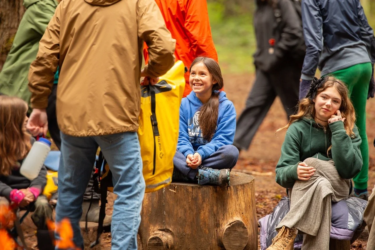 Outdoor school students engaging with outdoor teacher. Portland private school, nonprofit, alternative education- The Portland Forest School a community based, low ratio, open enrollment