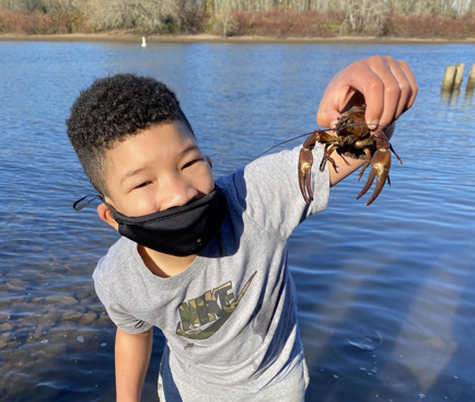 Elementary student outside at nonprofit private school, a nontraditional school the Portland Forest School where academics and mental health are important. An alternative middle school for curious kids to thrive. Community based, low ratio school wit