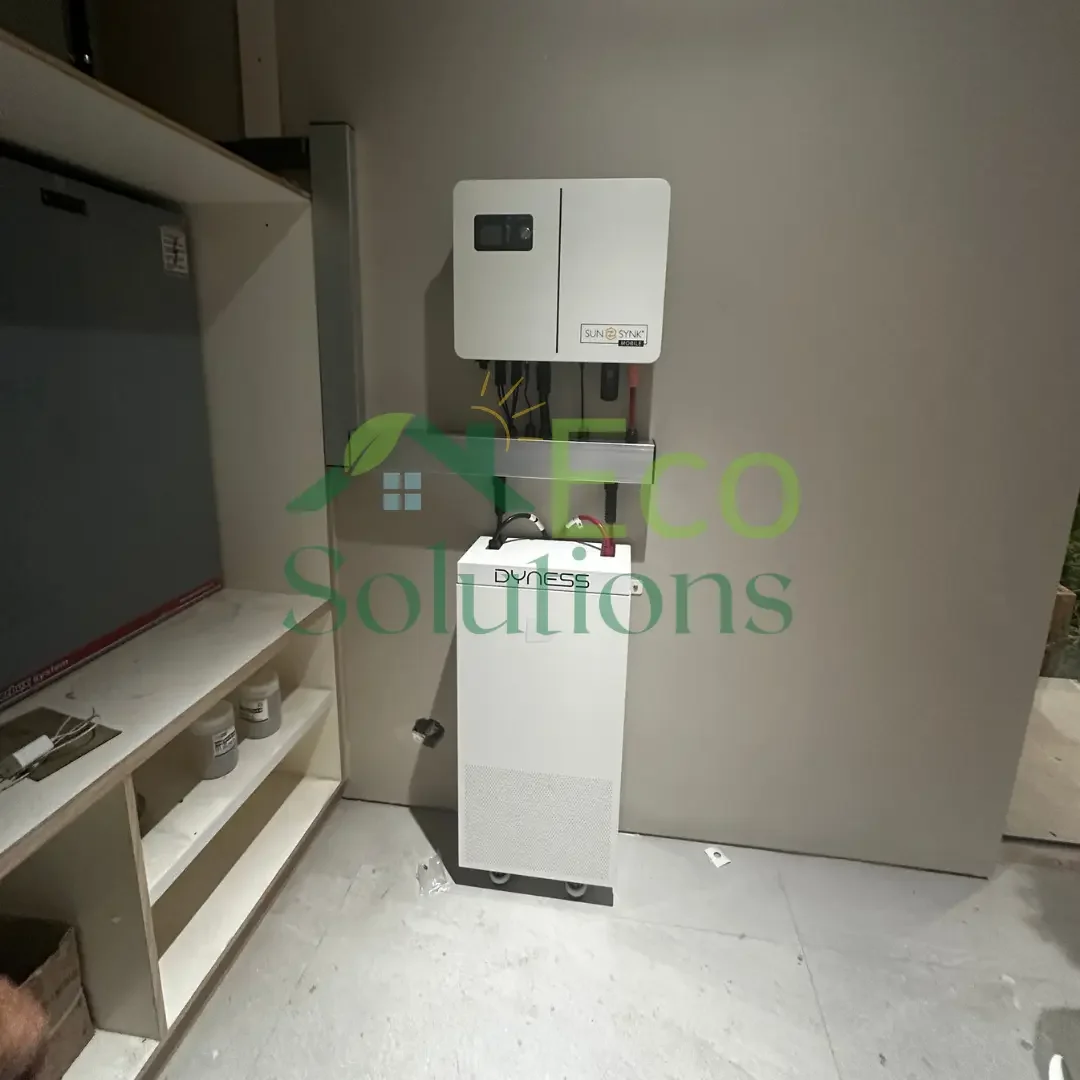 A high-resolution image of the 6 kW Sunsynk Gen 2 inverter mounted flush against the wall, emphasizing clean conduit work and labeling.