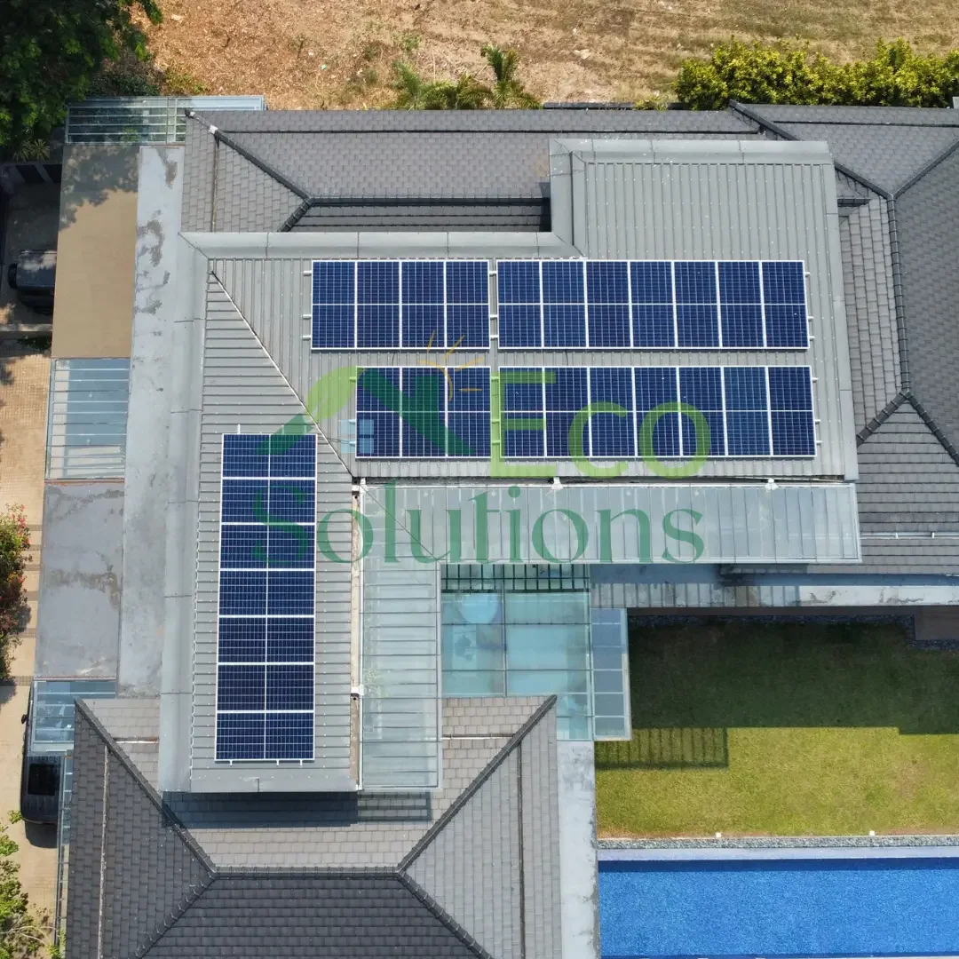 A low-angle drone shot emphasizing the sleek profile of the LONGi Back Contact panels against the modern luxury architecture of the home.