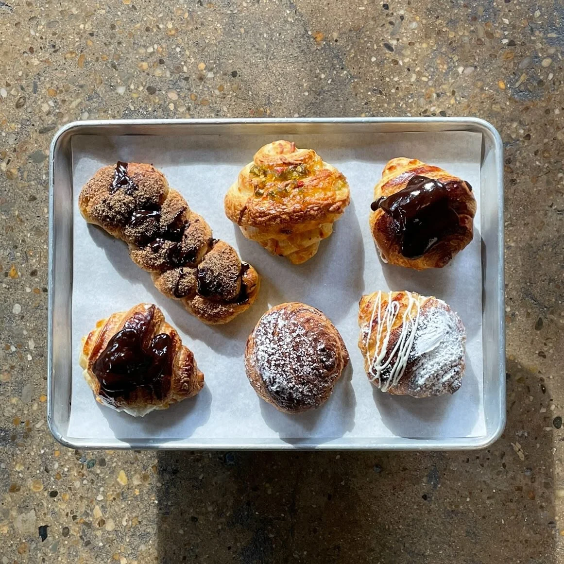 Boston cream, chocolate espresso churro, jalape&ntilde;o jelly + cheddar, chocolate, &amp; white chocolate croissants. Some days you just have to sample them all. #sourdough #sourdoughcroissants #organic #eatlocal #localbakery #vibedistrict #vibedist