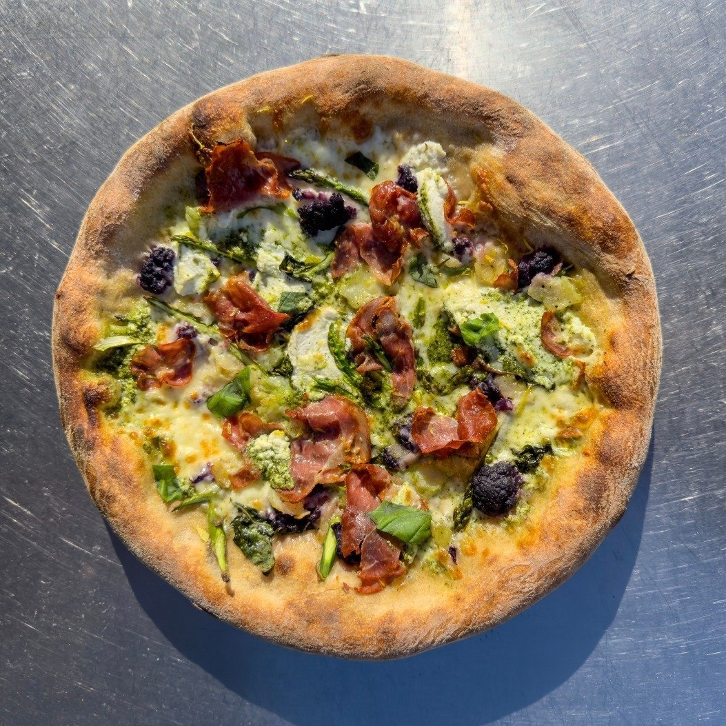 Spring has sprung 🌸, and so has our creativity with the debut of our latest masterpiece: the Spring Fling Pizza! 🍕 Imagine the perfect bite combining the savory delight of Italian Capocollo with the crisp freshness of shaved spring asparagus and a 