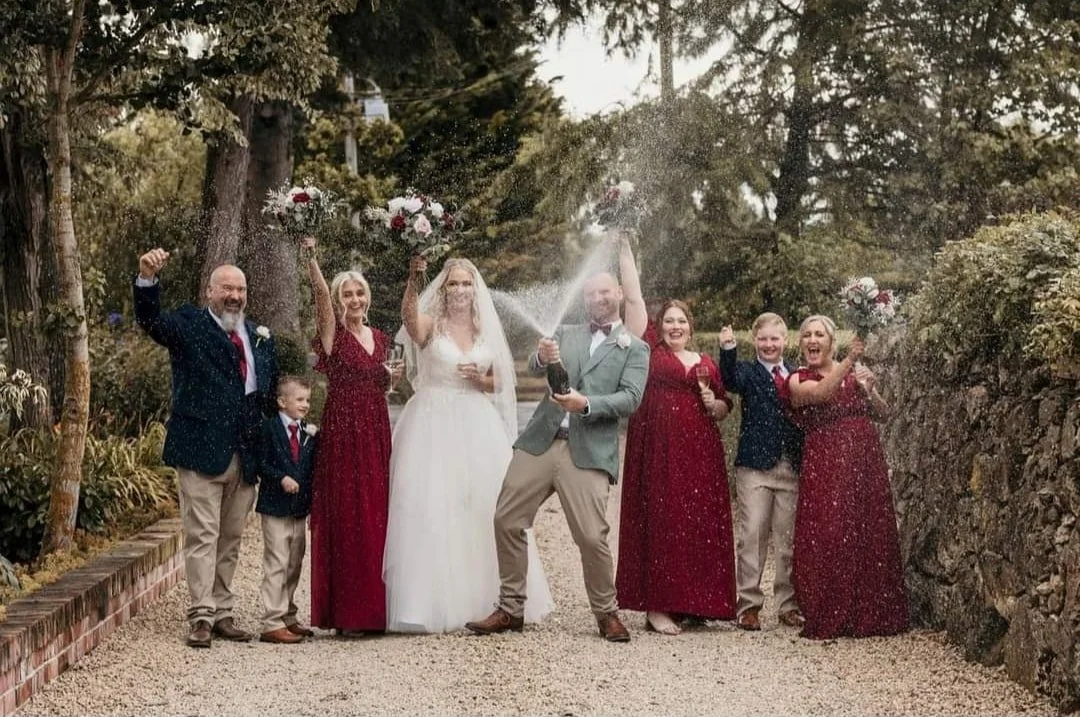 champagne spray by bridal party