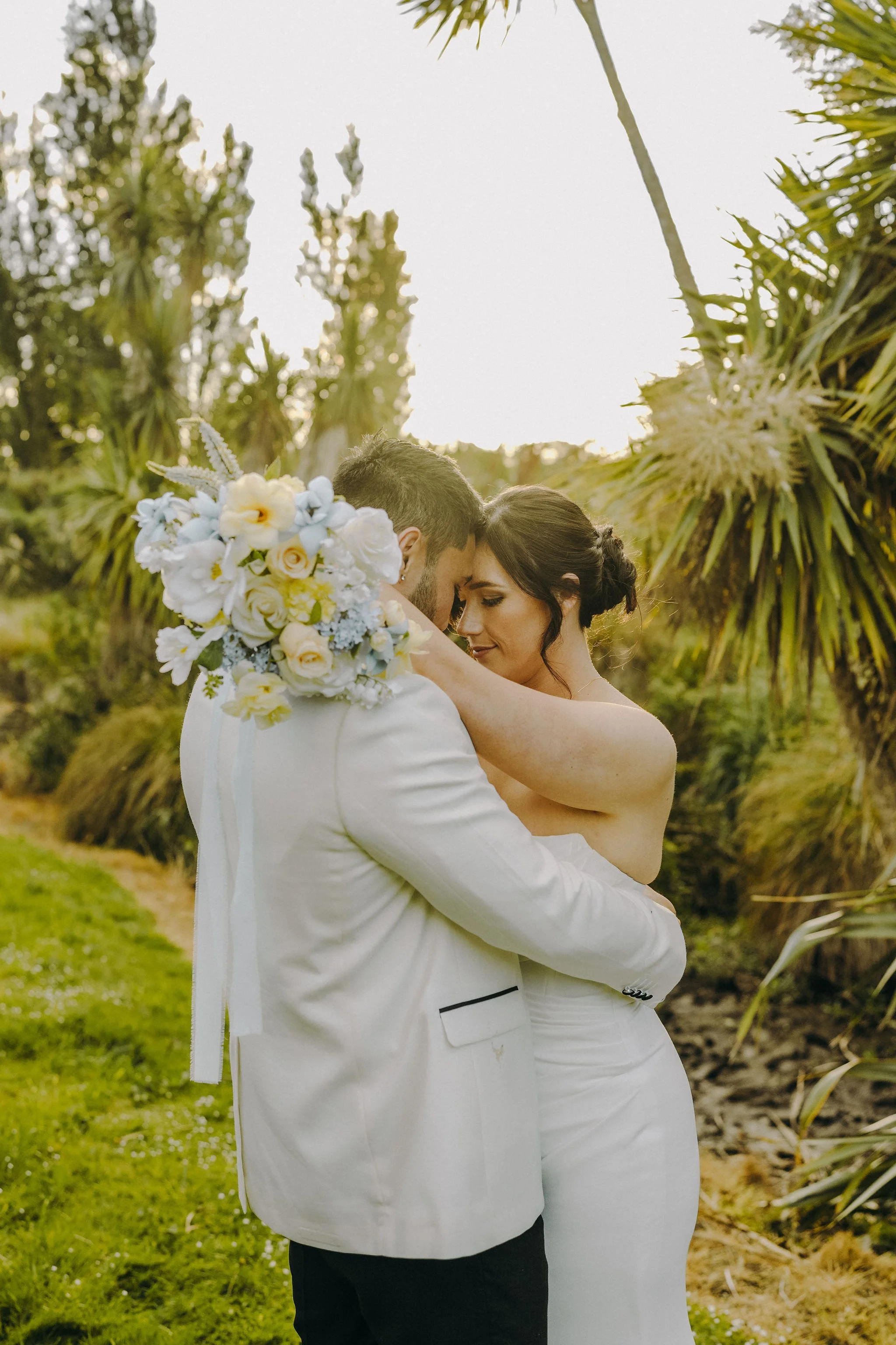 newlyweds enjoying private time during sunset