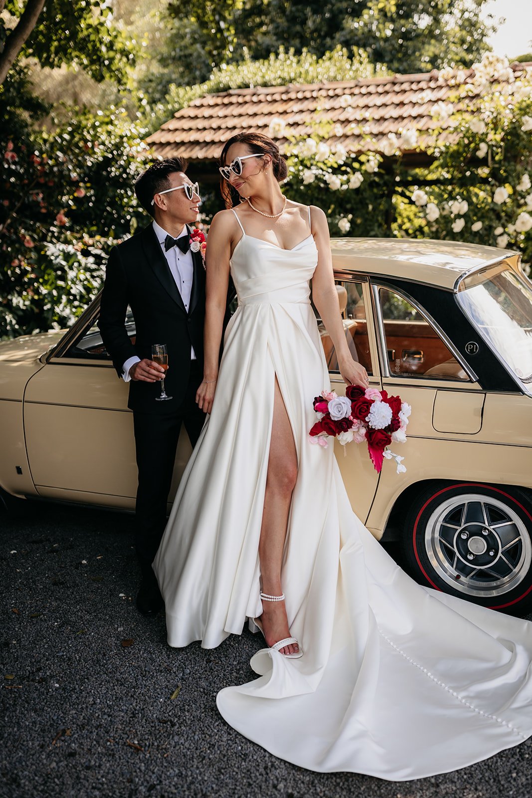 classic magazine style wedding image with bride looking over her shoulder to her groom