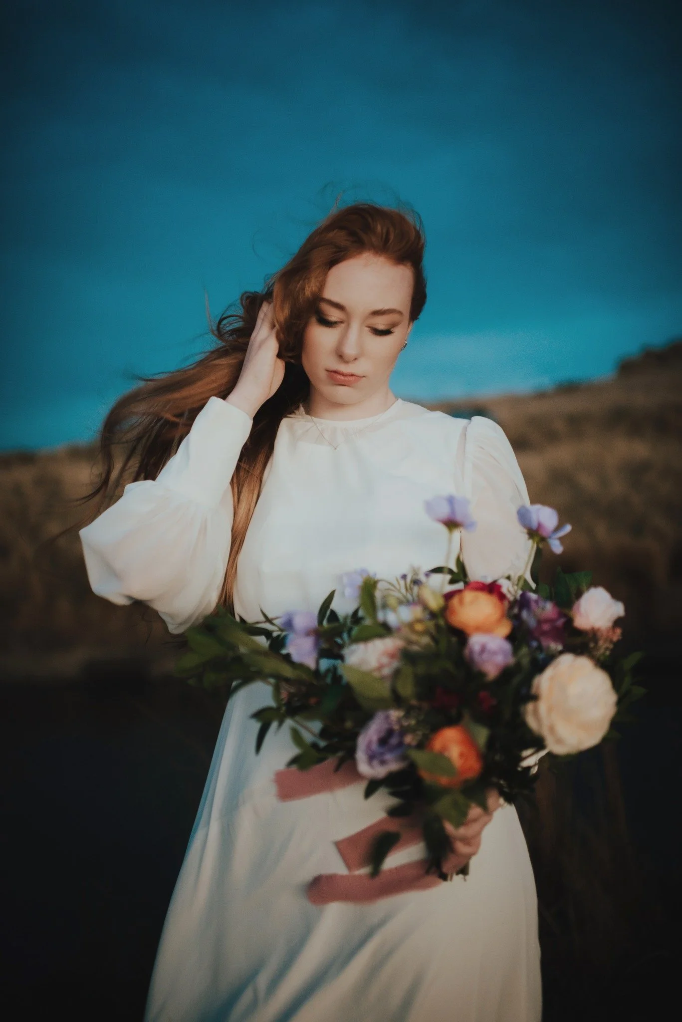 bridal portrait on port hills with spring inspired bouquet