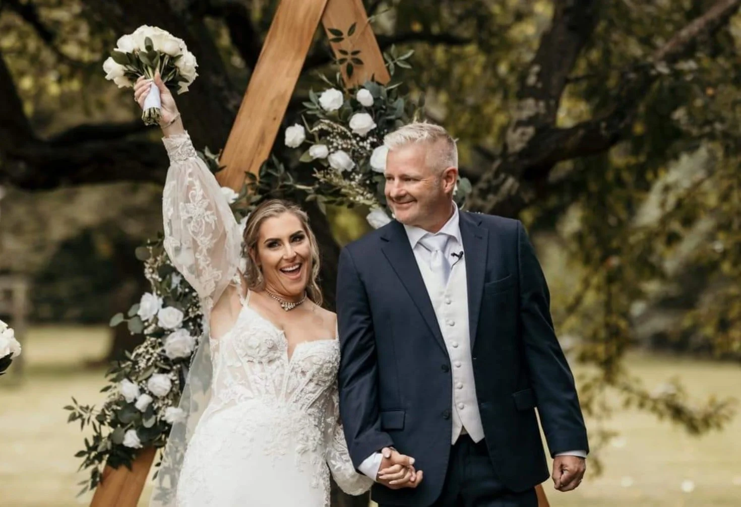 artificial floral arch triangular and matching bouquet