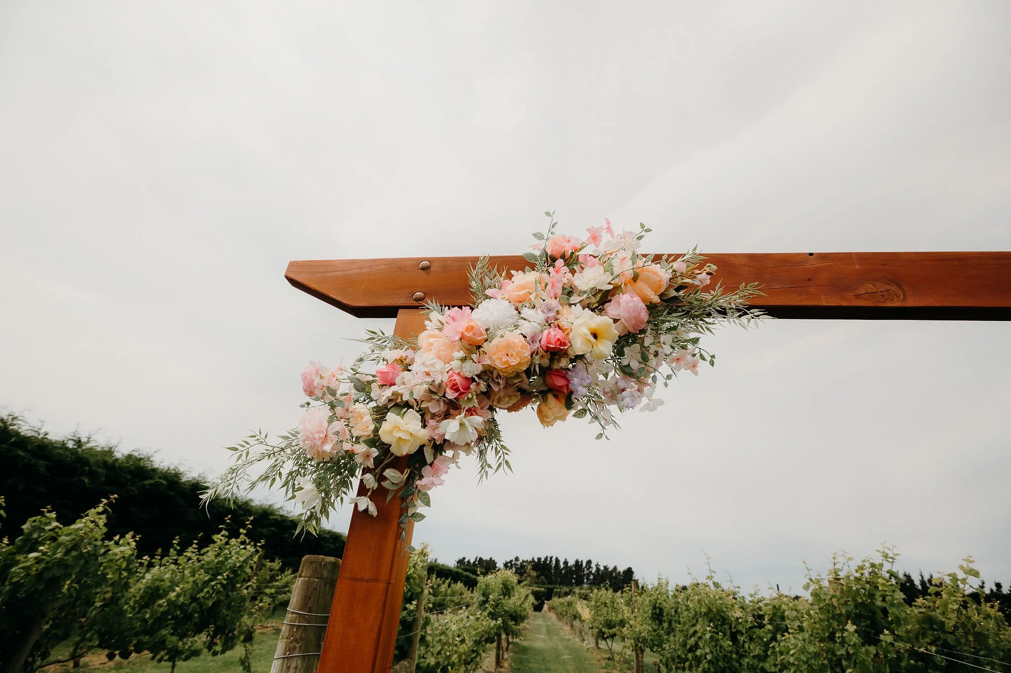 Artificial floral wedding arch arrangement pastel colours 